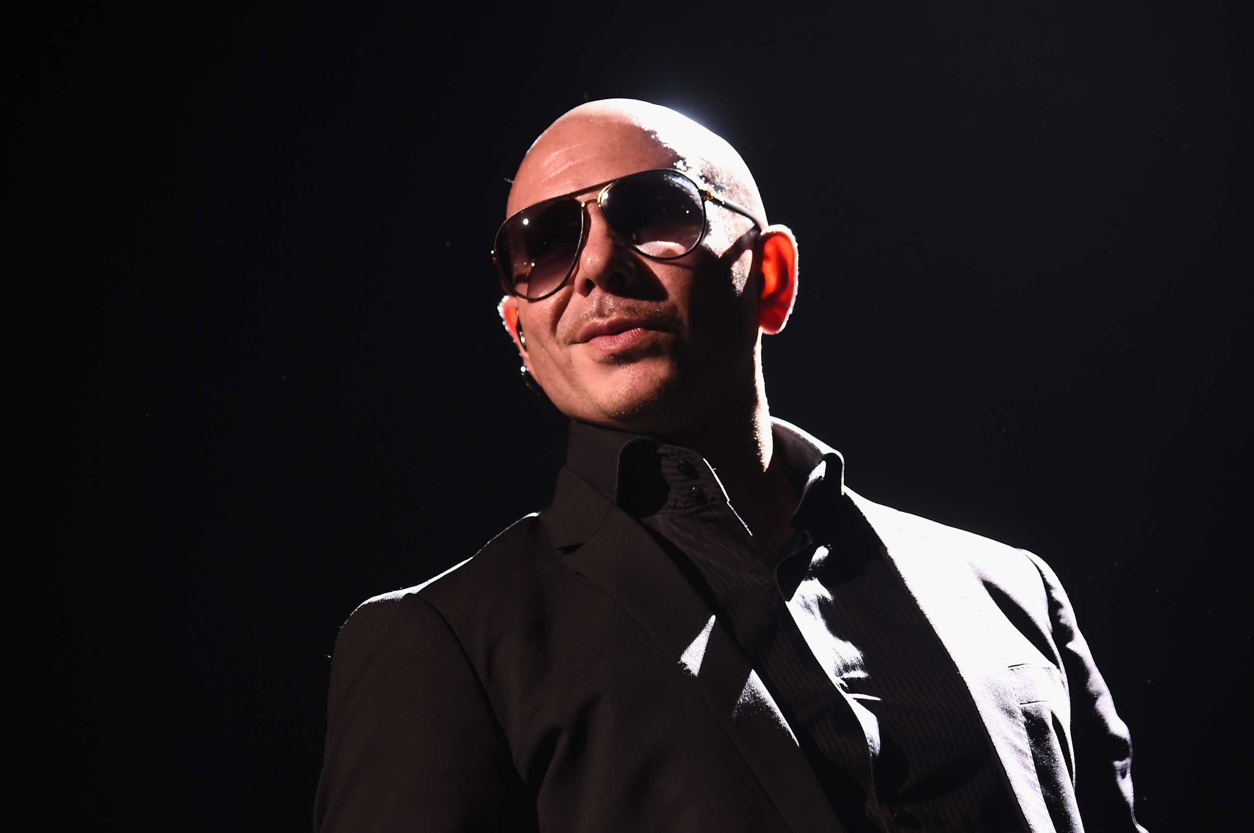 Artist Pitbull performs onstage in New York City, July 19, 2015. (Michael Loccisano—Getty Images)
