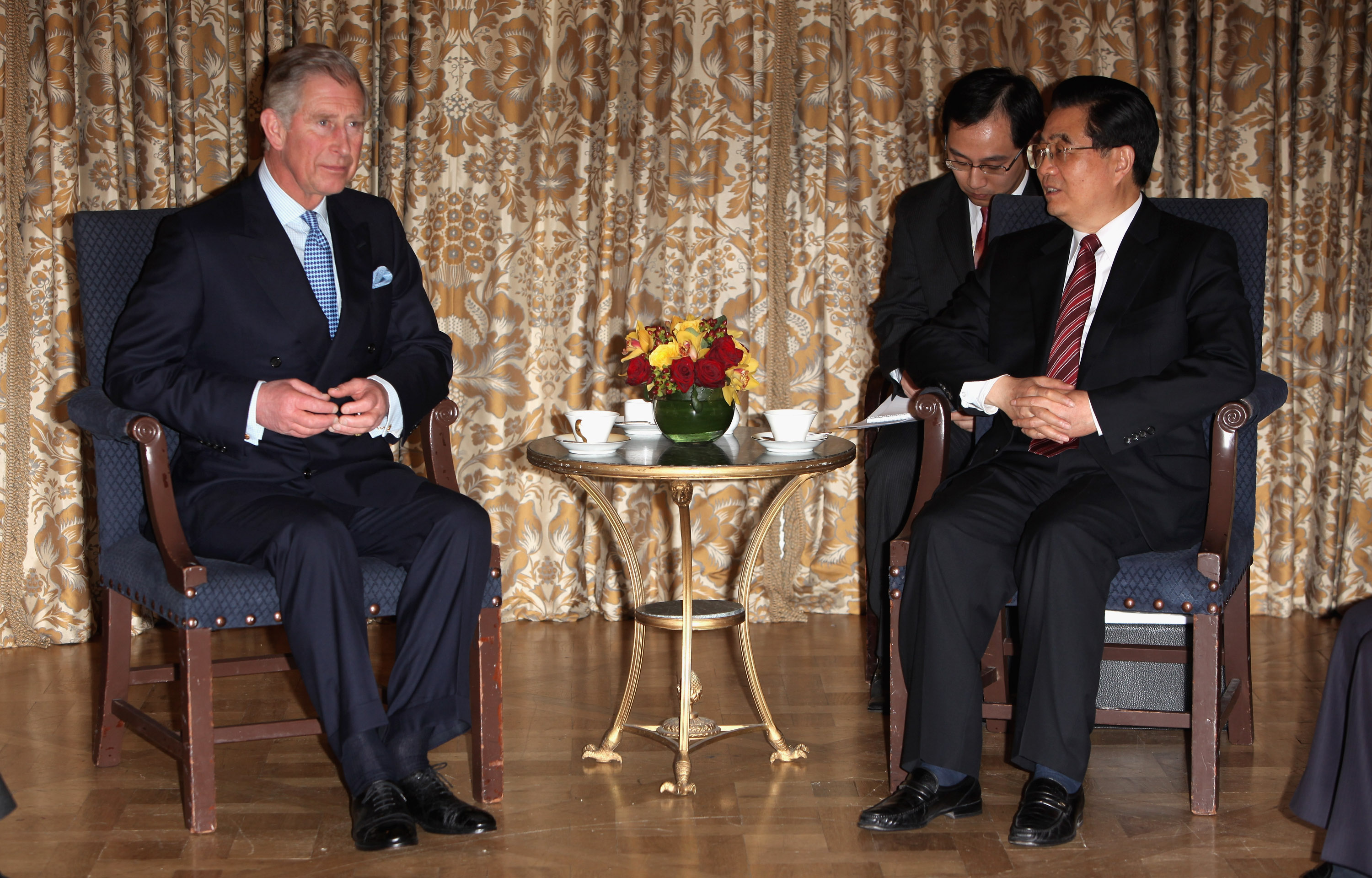 The Prince of Wales, left, speaks with then Chinese President Hu Jintao on April 2, 2009, in London (Tim Whitby—AP)