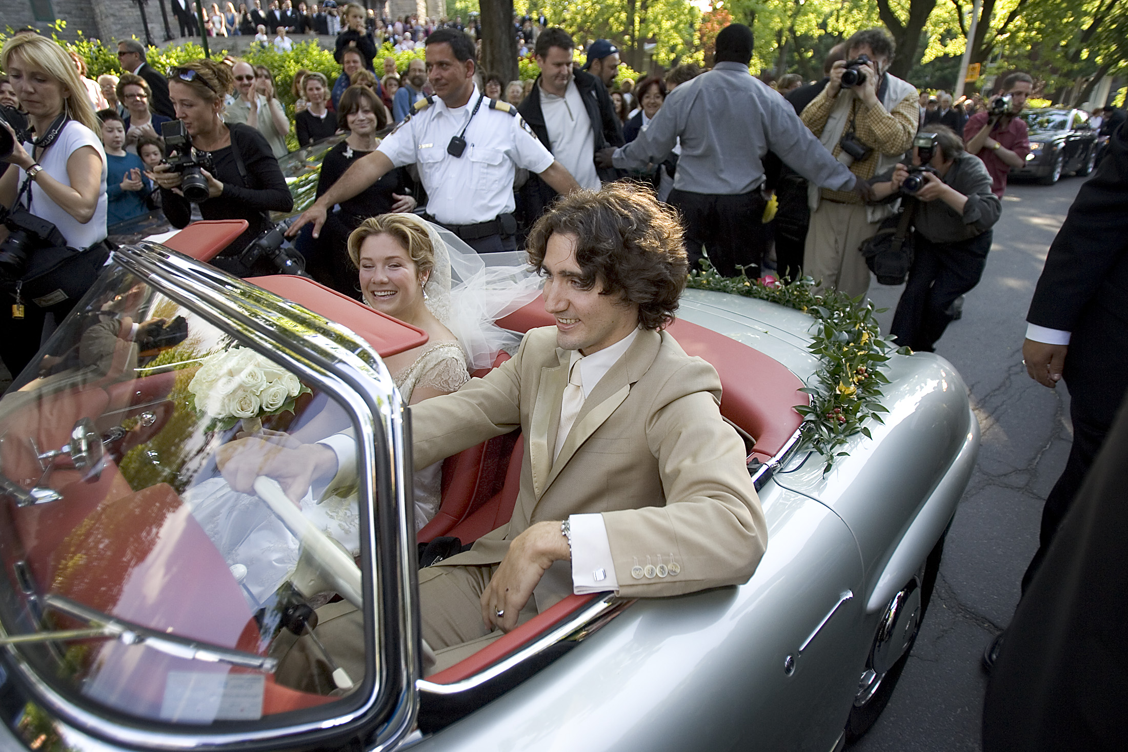 Justin Trudeau and new bride Sophie Gregoire leave in father's 1959 Mercedes 300SL.