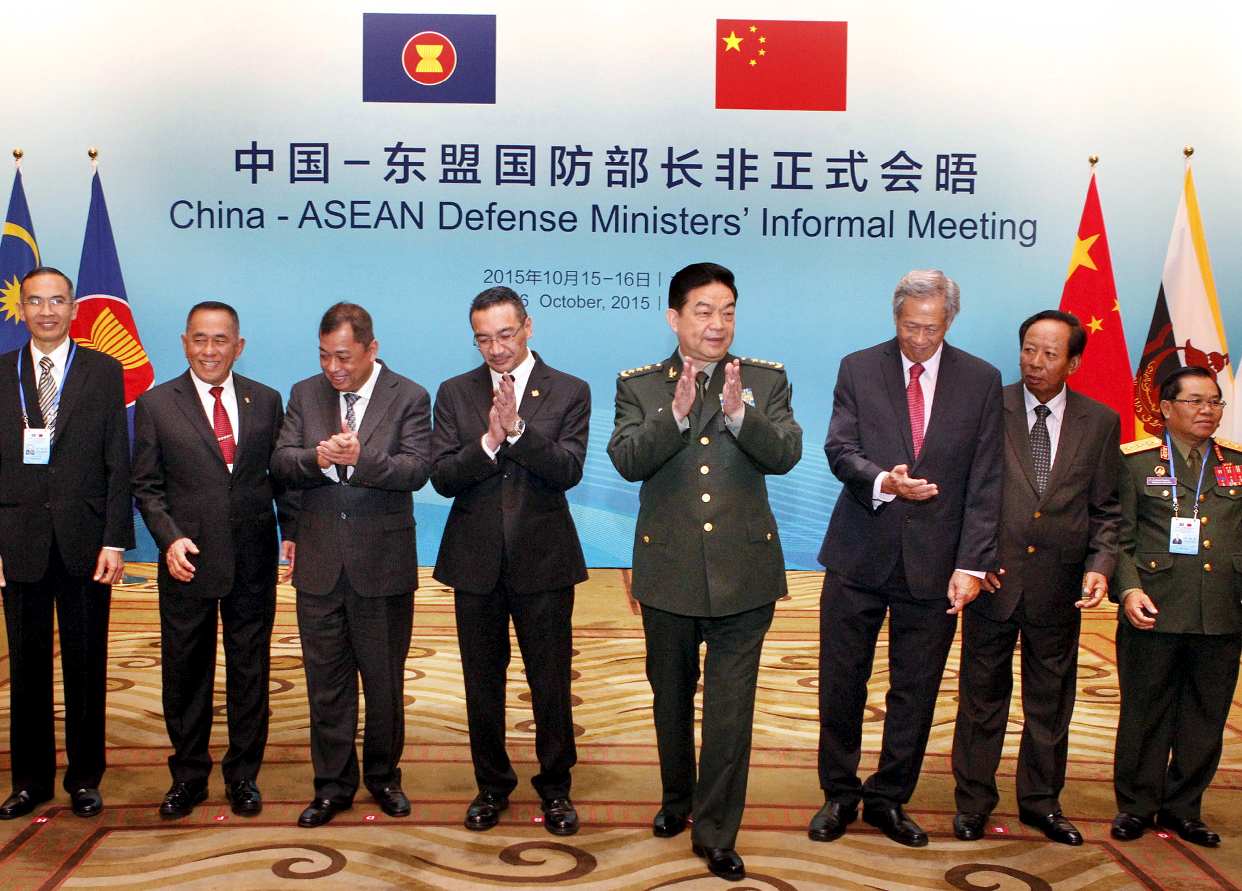 Chinese Defense Minister Chang Wanquan (fourth from right) claps next to his counterparts from the Southeast Asian Nations (ASEAN) during the China-ASEAN Defense Ministers' Informal Meeting in Beijing, China, October 16, 2015. (Stringer—Reuters)