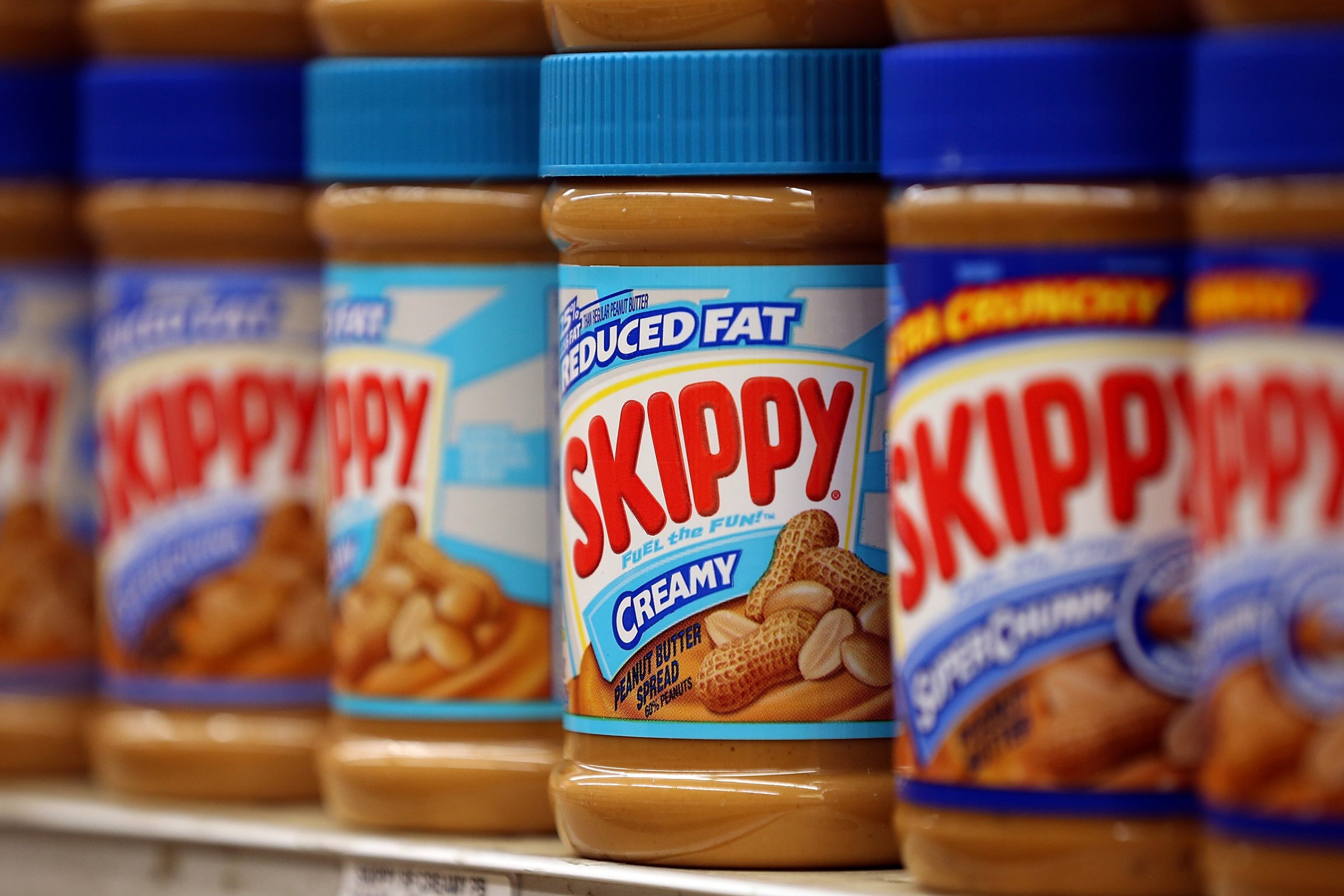 SAN FRANCISCO, CA - JANUARY 03: Jars of Skippy peanut butter are displayed on a shelf at Cal Mart grocery store on January 3, 2013 in San Francisco, California. Hormel, the maker of Spam, announced that it will purchase the Skippy peanut butter brand from Unilever for $700 million in cash. (Photo by Justin Sullivan/Getty Images)