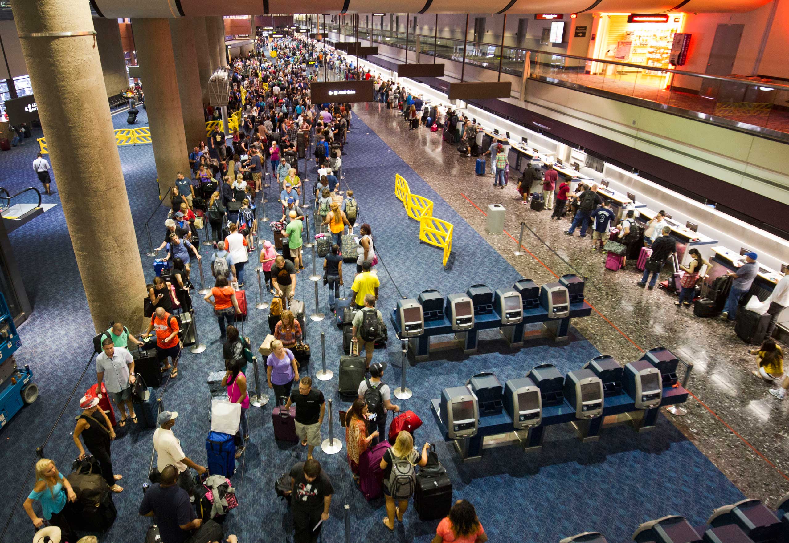 Departing Southwest Airlines passengers wait in line at McCarran International Airport in Las Vegas, Oct. 11, 2015. (Steve Marcus—AP)