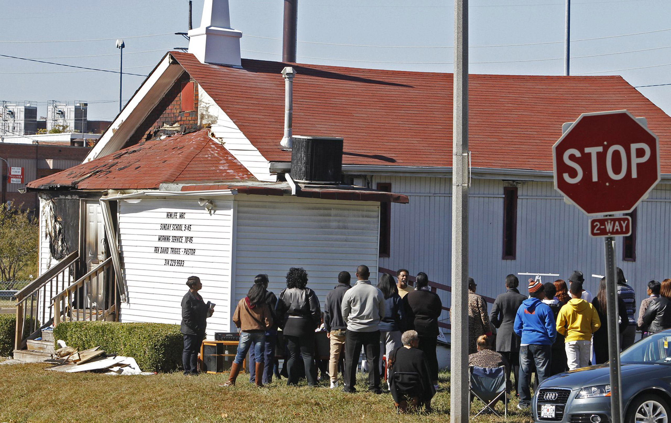 An outdoor service is held following a fire at the New Life Missionary Baptist Church in St. Louis on Oct. 18, 2015. (J.B. Forbes—St. Louis Post-Dispatch/AP)