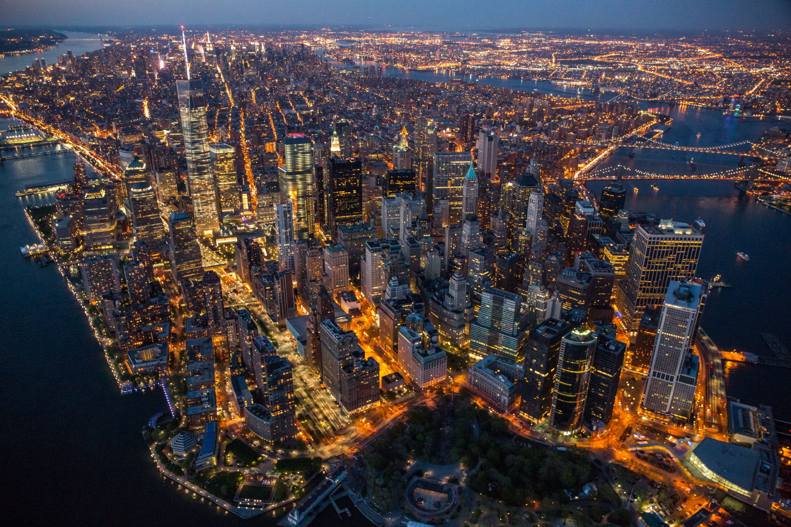 At twilight, Manhattan resembles a vast living organism with ribbons of energy pulsing through its streets and up into its hundred thousand buildings.