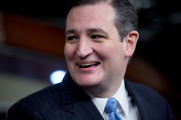 Senator Ted Cruz, a Republican from Texas, laughs during a news conference on the Department of Homeland Security (DHS) funding bill in Washington, D.C., U.S., on Thursday, Feb. 12, 2015.