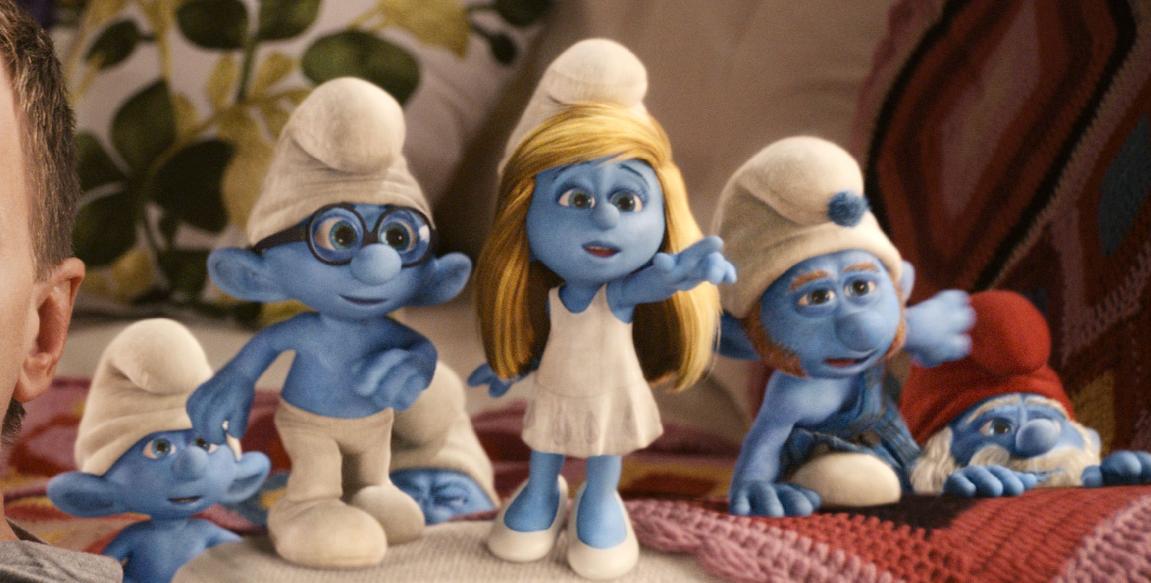 Neil Patrick Harris as "Patrick" with Clumsy, Briany, Smurfette, Gutsy and Papa Smurf in Columbia Pictures' THE SMURFS.