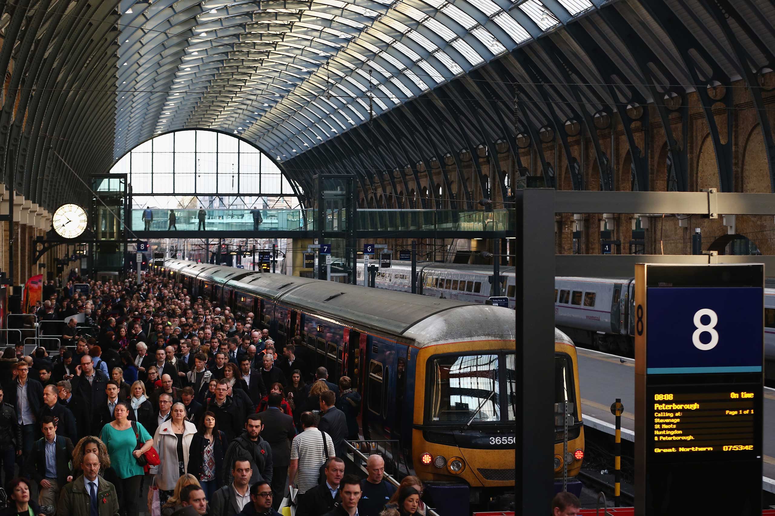 Passengers disembark a train at King's Cross station in London. (Dan Kitwood—Getty Images)