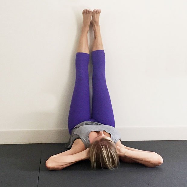yoga-poses-karna-pidasana-modified-legs-up-wall