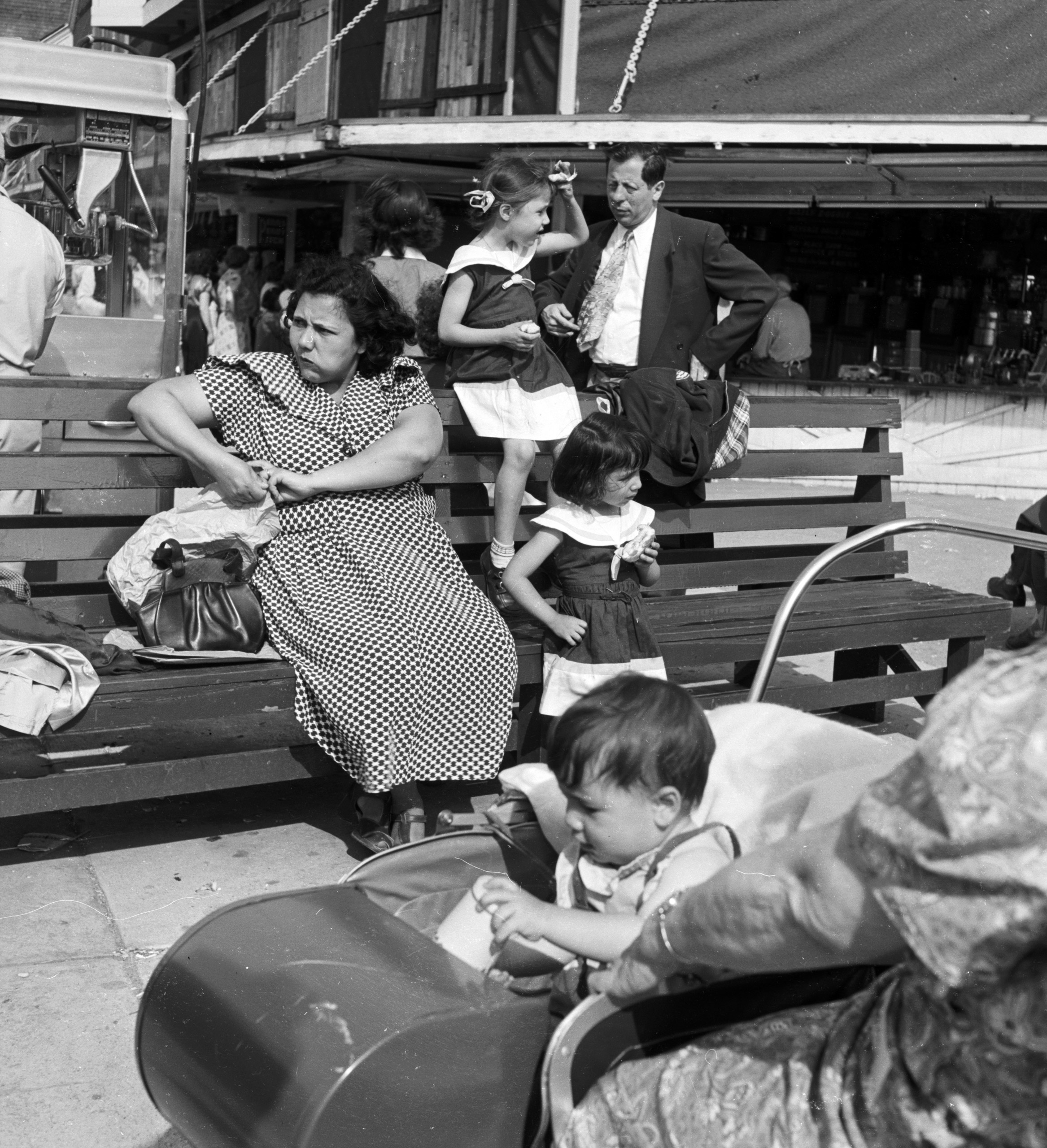 People relaxing on the sea front at Coney Island, New York.