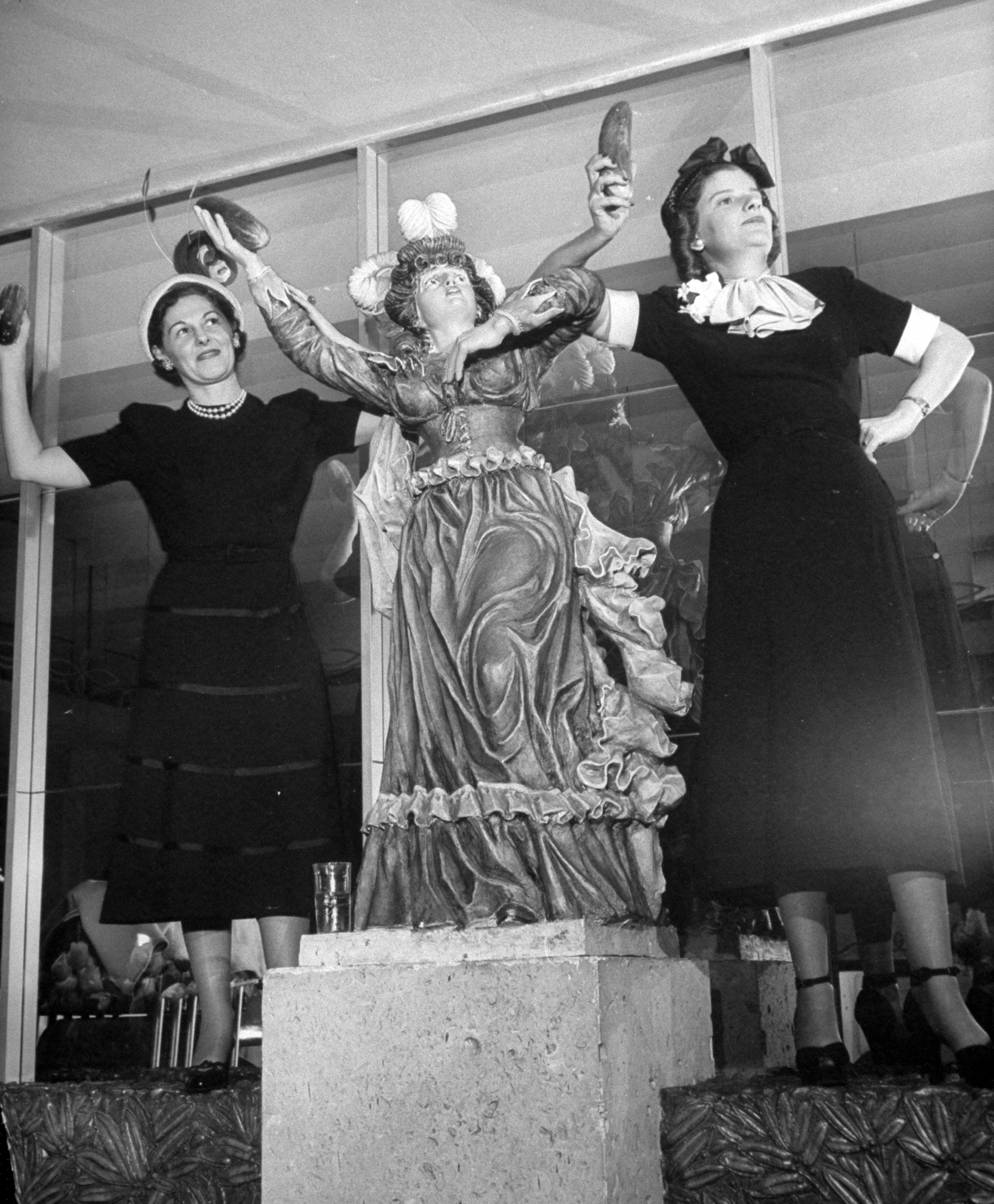 Models showing off pickles for National Pickle Week, 1949.