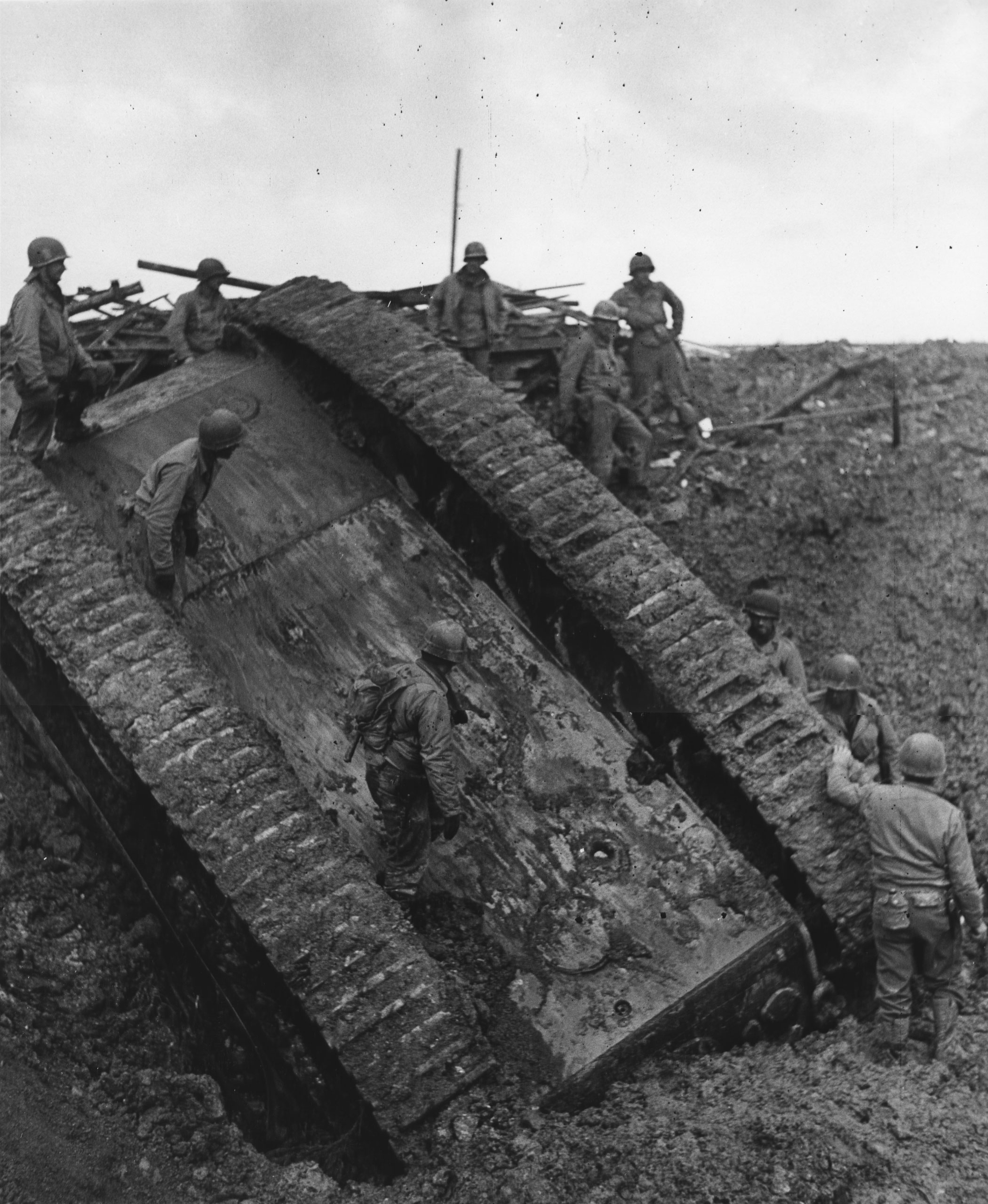 Overturned German Tank inspected by U.S. soldiers , November 24, 1944