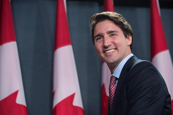 Canadian Liberal Party leader Justin Trudeau smiles at the end of a press conference in Ottawa on Oct. 20, 2015, after winning the general elections (Nicholas Kamm—AFP/Getty Images)