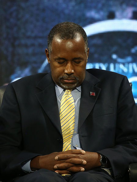 Dr. Ben Carson participates in a prayer during a rally at the University, on November 11, 2015 in Lynchburg, Virginia. (Mark Wilson&mdash;Getty Images)