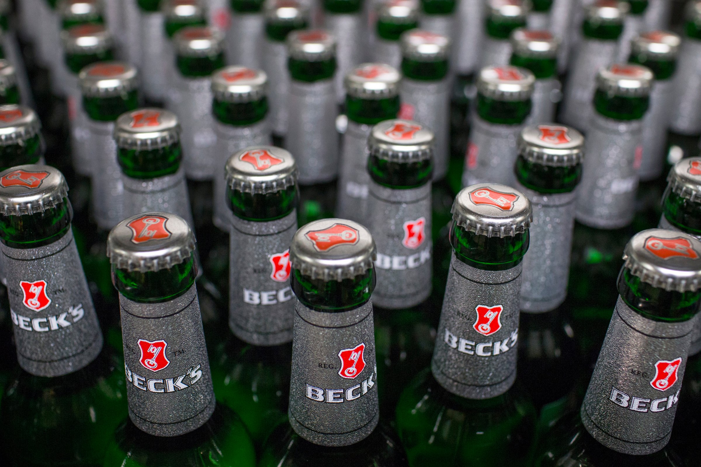 Bottles of Beck's lager beer move along the production line