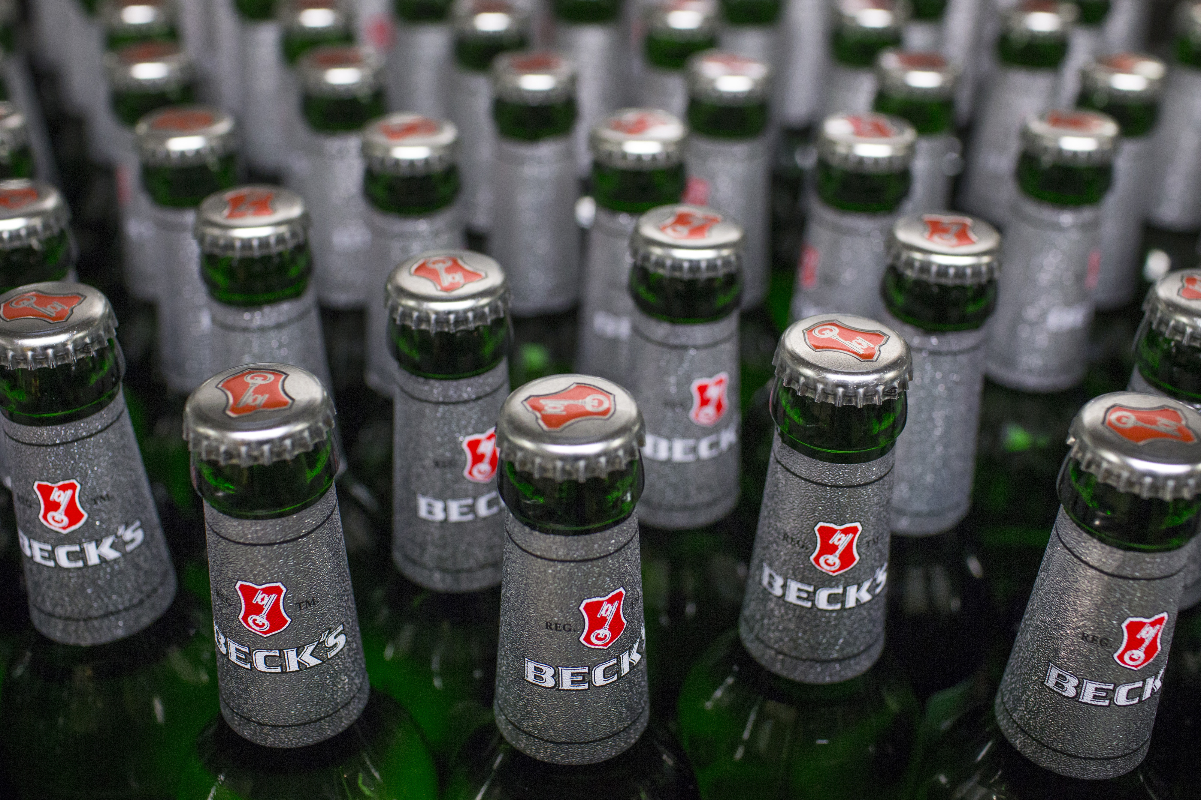 Bottles of Beck's lager beer move along the production line at the Beck's brewery, operated by Anheuser-Busch InBev NV, in Bremen, Germany on Nov. 4, 2015. (Jasper Juinen—Bloomberg/Getty Images)