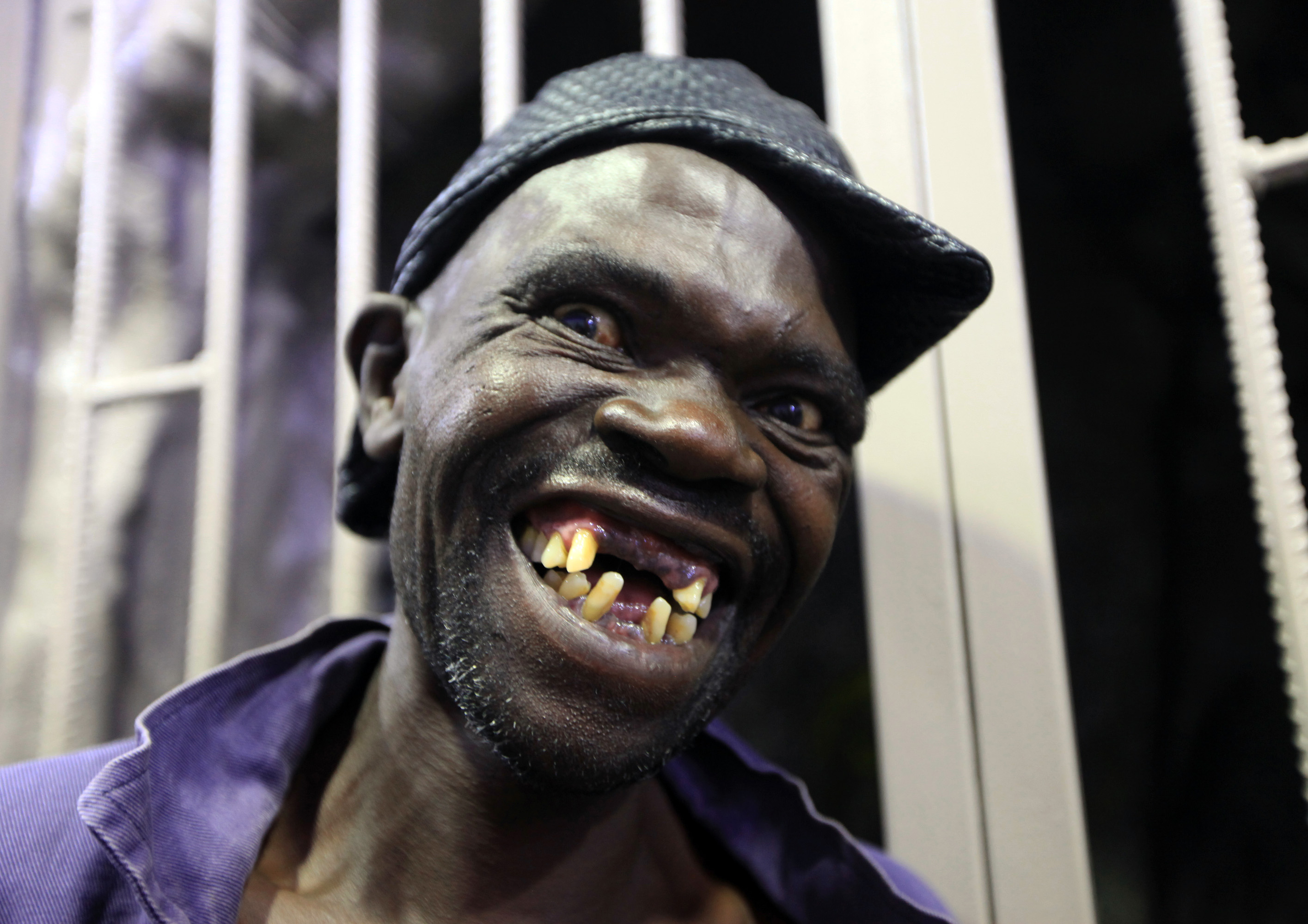 Mison Sere smiles after winning the 2015 Mr. Ugly competition in Harare, Zimbabwe, on Nov. 21, 2015 (Tsvangirayi Mukwazhi—AP)
