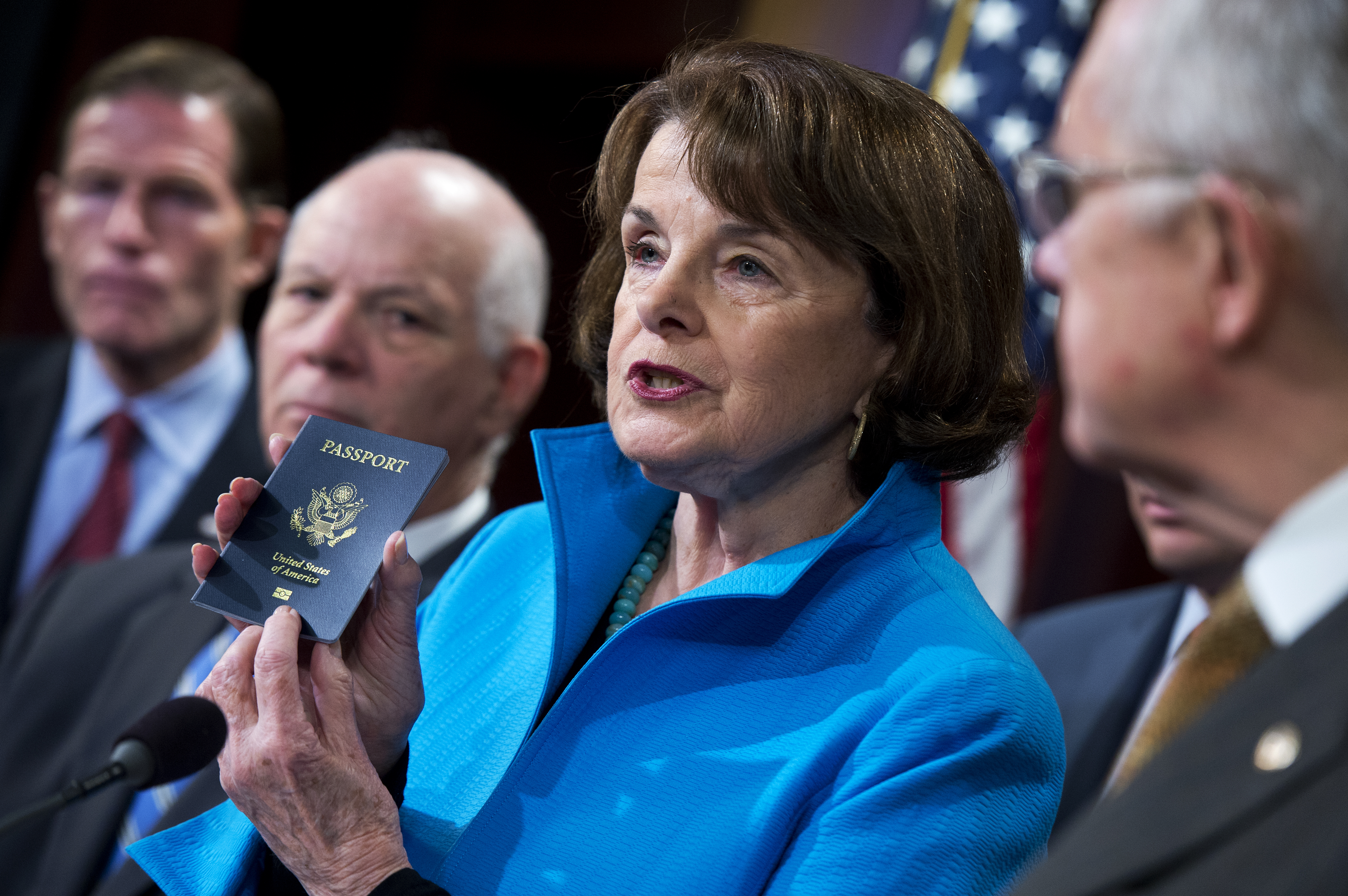 Dianne Feinstein, D-Calif., shows her passport during a news conference on closing loopholes in the Visa Waiver Program, Nov. 19, 2015. (Tom Williams—CQ Roll Call/AP)