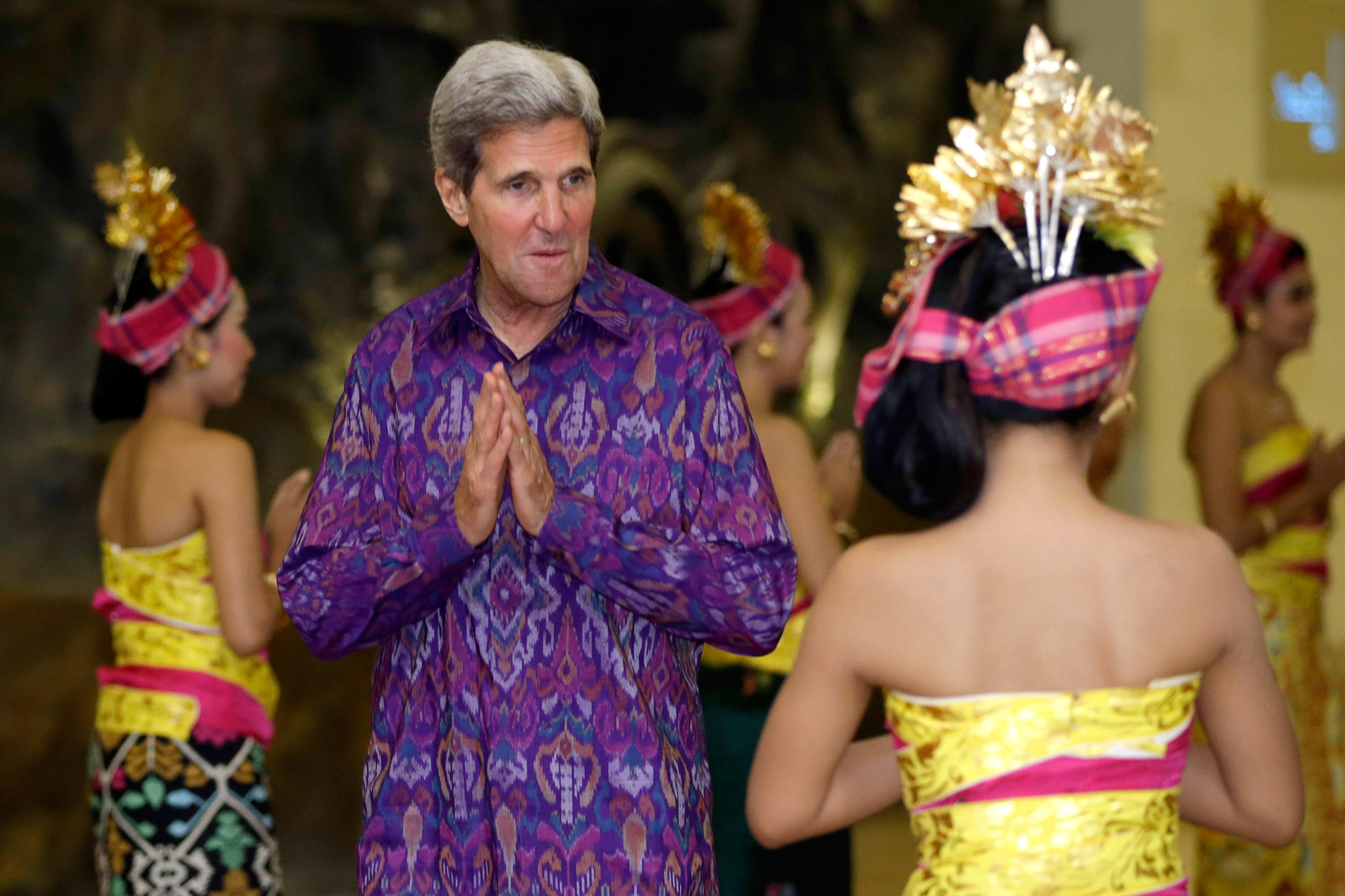 U.S. Secretary of State John Kerry, wearing a traditional Balinese woven fabric called an  endek,  arrives at a gala for the leaders at the APEC Summit in Nusa Dua on the Indonesian resort island of Bali on Oct. 7, 2013.