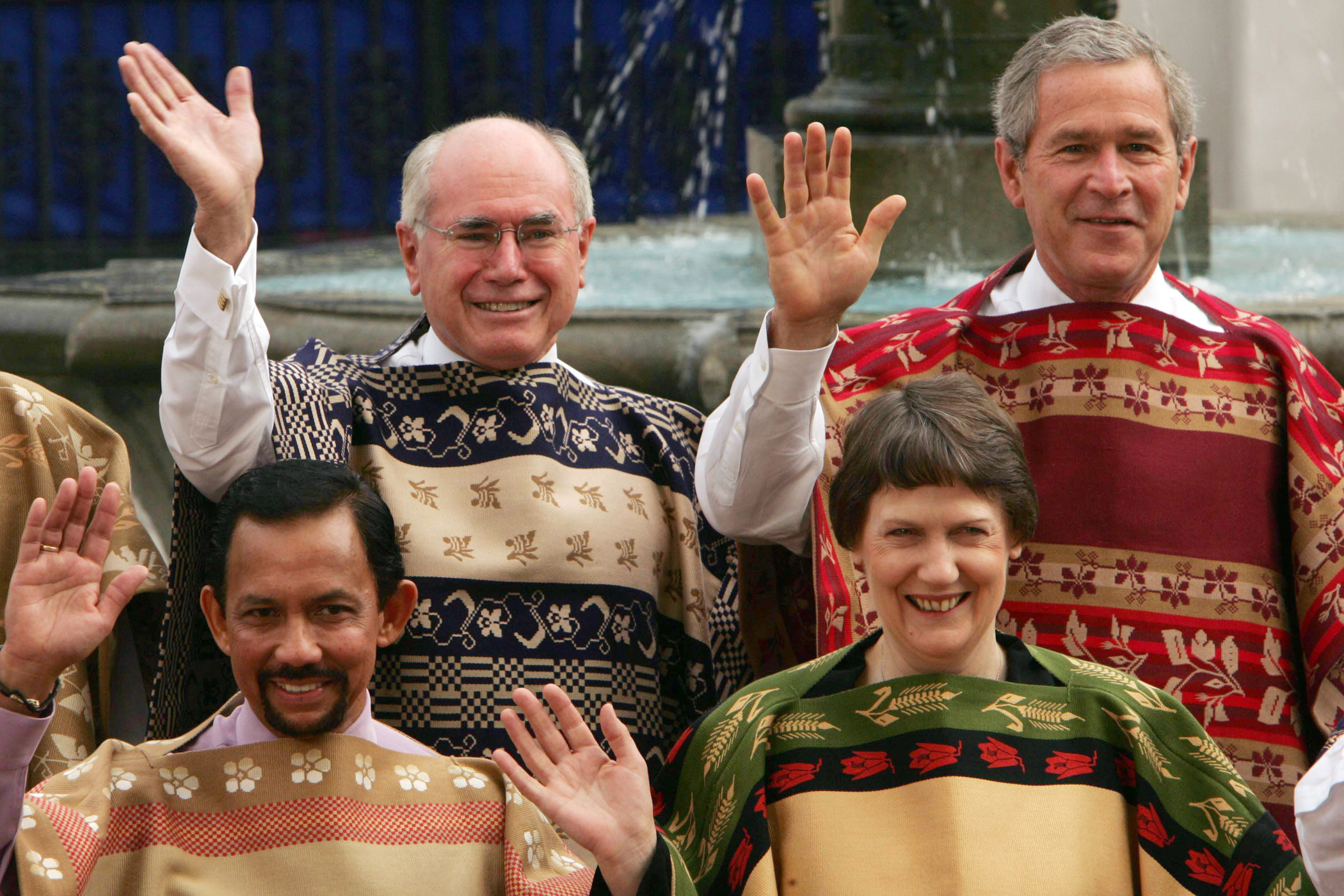 APEC leaders, clockwise from top left, Australian Prime Minister John Howard, U.S. President George Bush, Sultan Haji Hassanal Bolkiah Mujizzaddin Waddaulah, of Brunei, and New Zealand Prime Minister Helen Clark pose for a photo call wearing the Chilean traditional Chamanto at the APEC Summit in Santiago on Nov. 21, 2004.