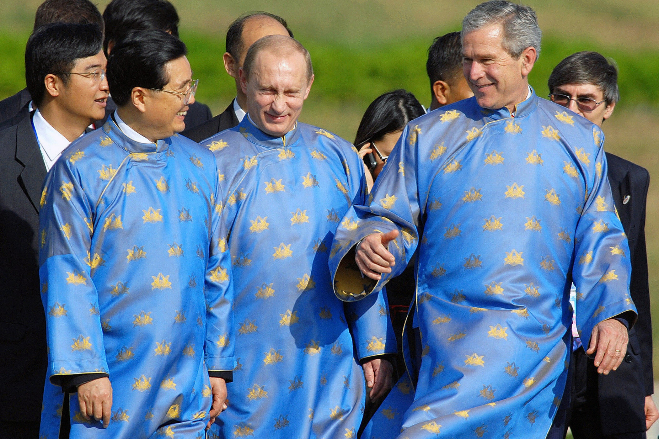 From left, Chinese President Hu Jintao, Russian President Vladimir Putin and U.S. President George W. Bush wear traditional attire during the APEC Summit in Hanoi on Nov. 19, 2006.