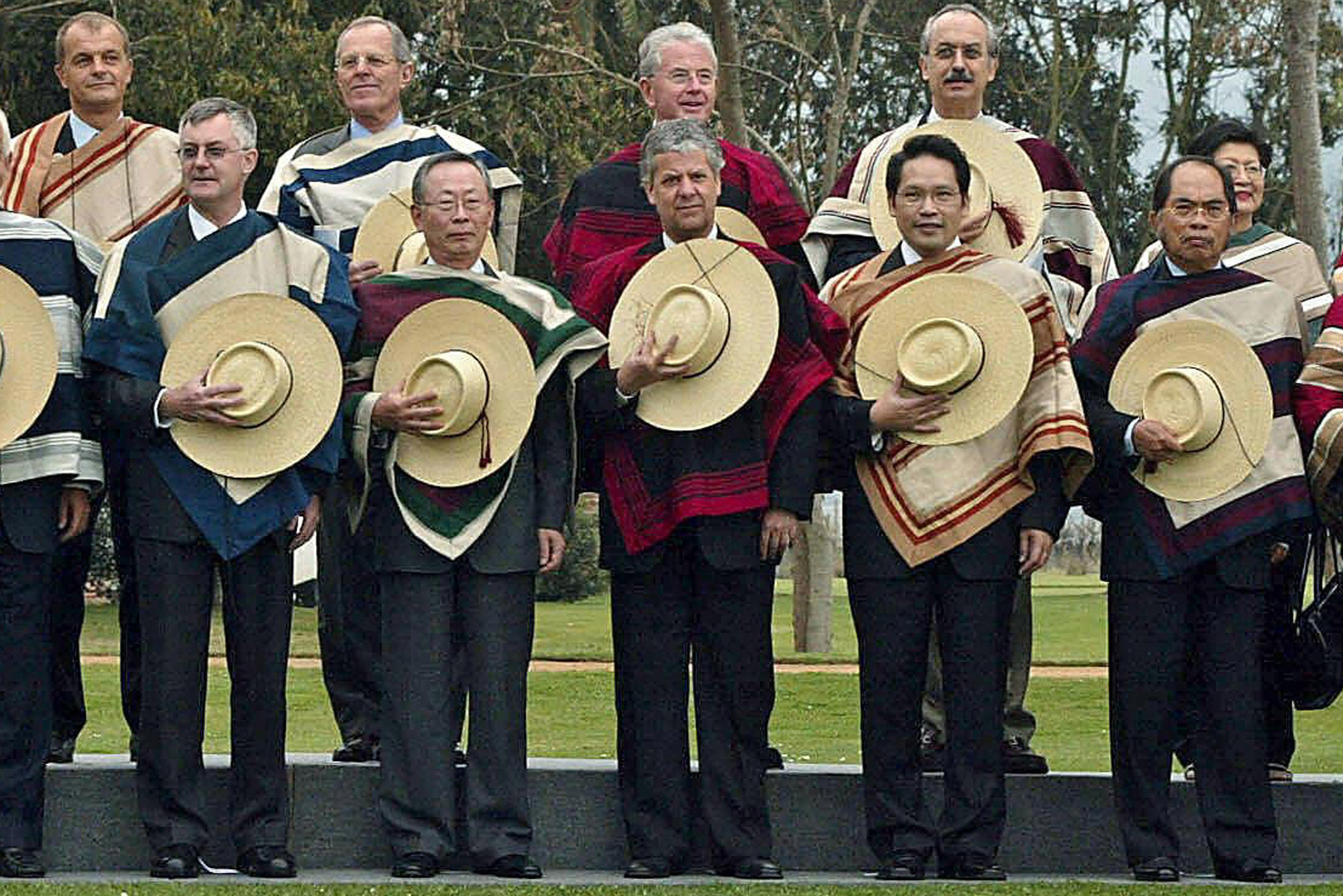 Ministers and delegates of the 11th APEC Summit pose for a photo wearing local garb in Santiago on Sept. 3, 2004.