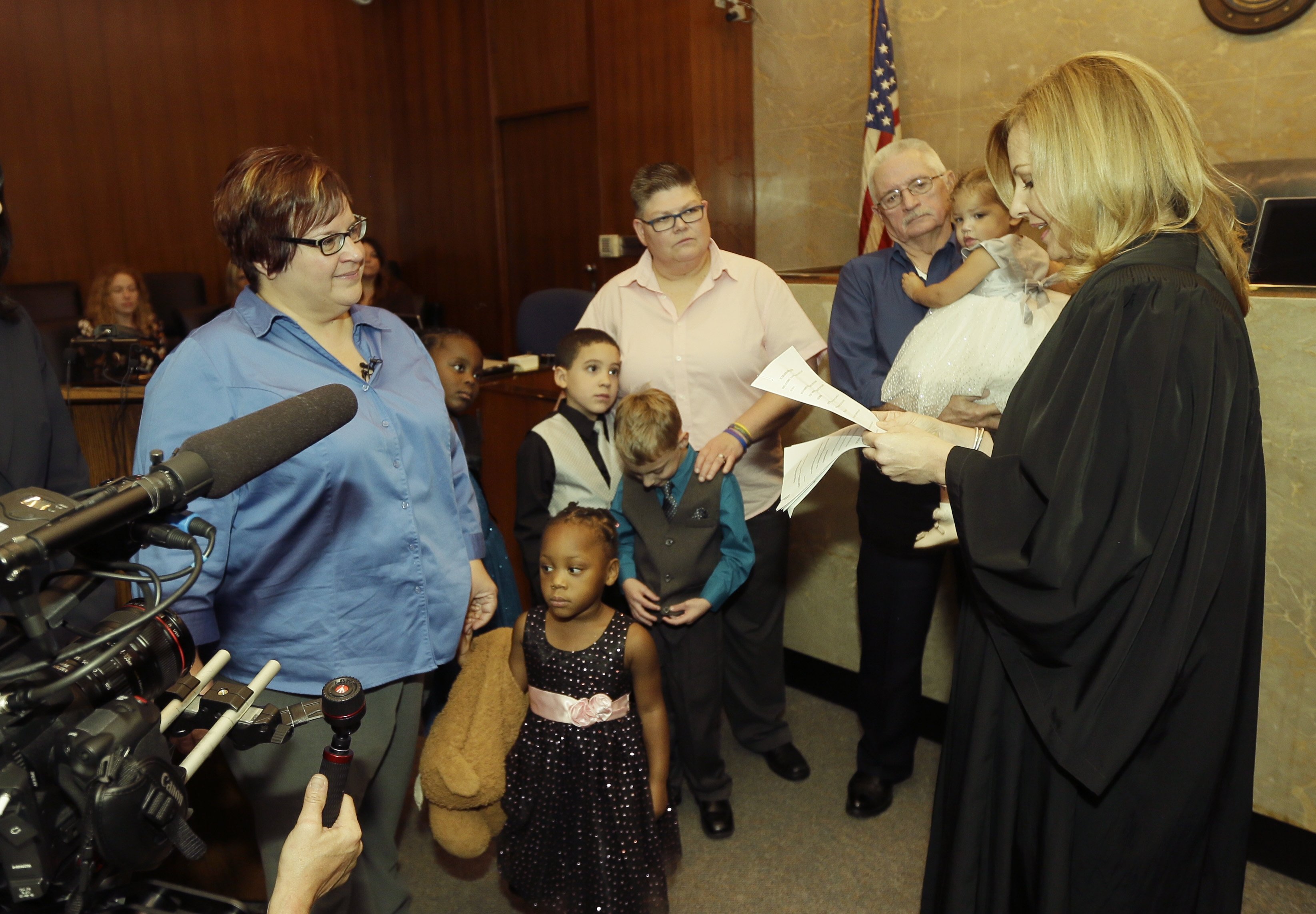 April DeBoer and Jayne Rowse stand before Judge Karen McDonald during an adoption ceremony at the Oakland County Circuit Court, in Pontiac, Mich. on Nov. 5, 2015. (Carlos Osorio—AP)