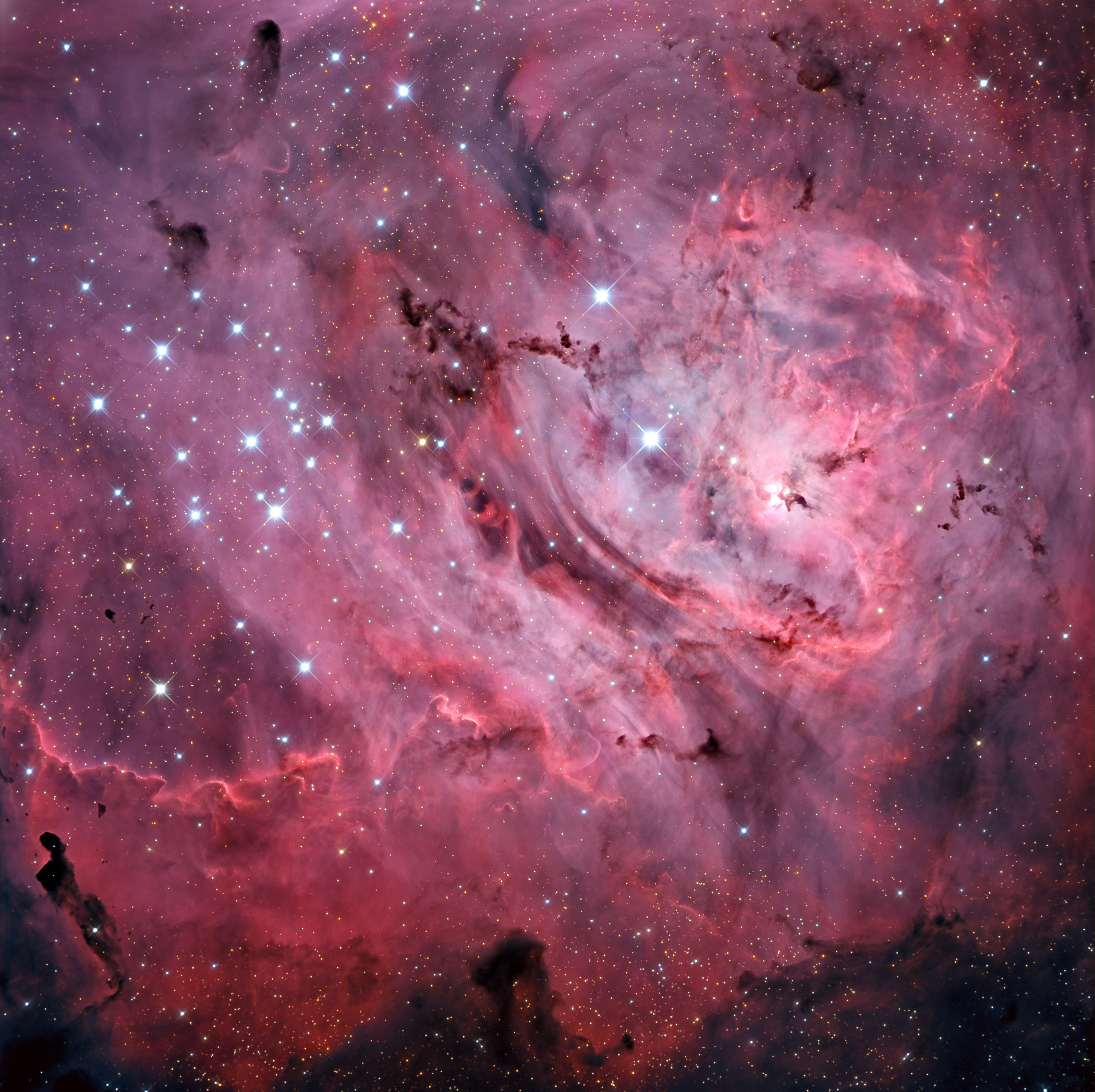 The Lagoon Nebula, a bright cloud of dust and gas 4,000 light years away and 40 light years across, glows brilliantly due to hot energetic young stars forming within. It can even be glimpsed with the unaided eye under dark skies away from city lights. The photo was captured at the Mount Lemmon SkyCenter in Arizona and released on July 15, 2015.