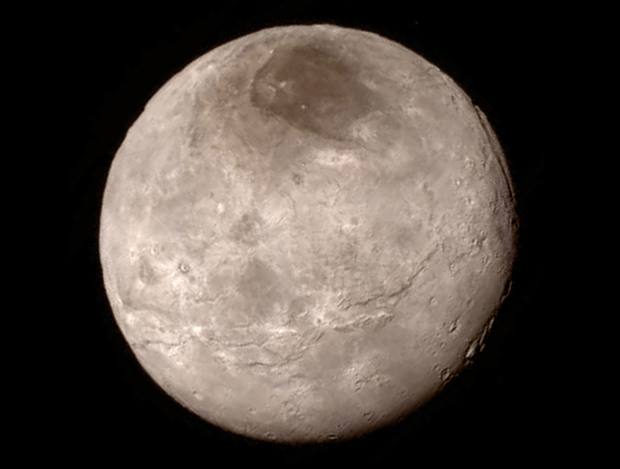 Charon, the largest moon of Pluto, captured by the New Horizons spacecraft on July 13, 2015 from a distance of 290,000 miles.