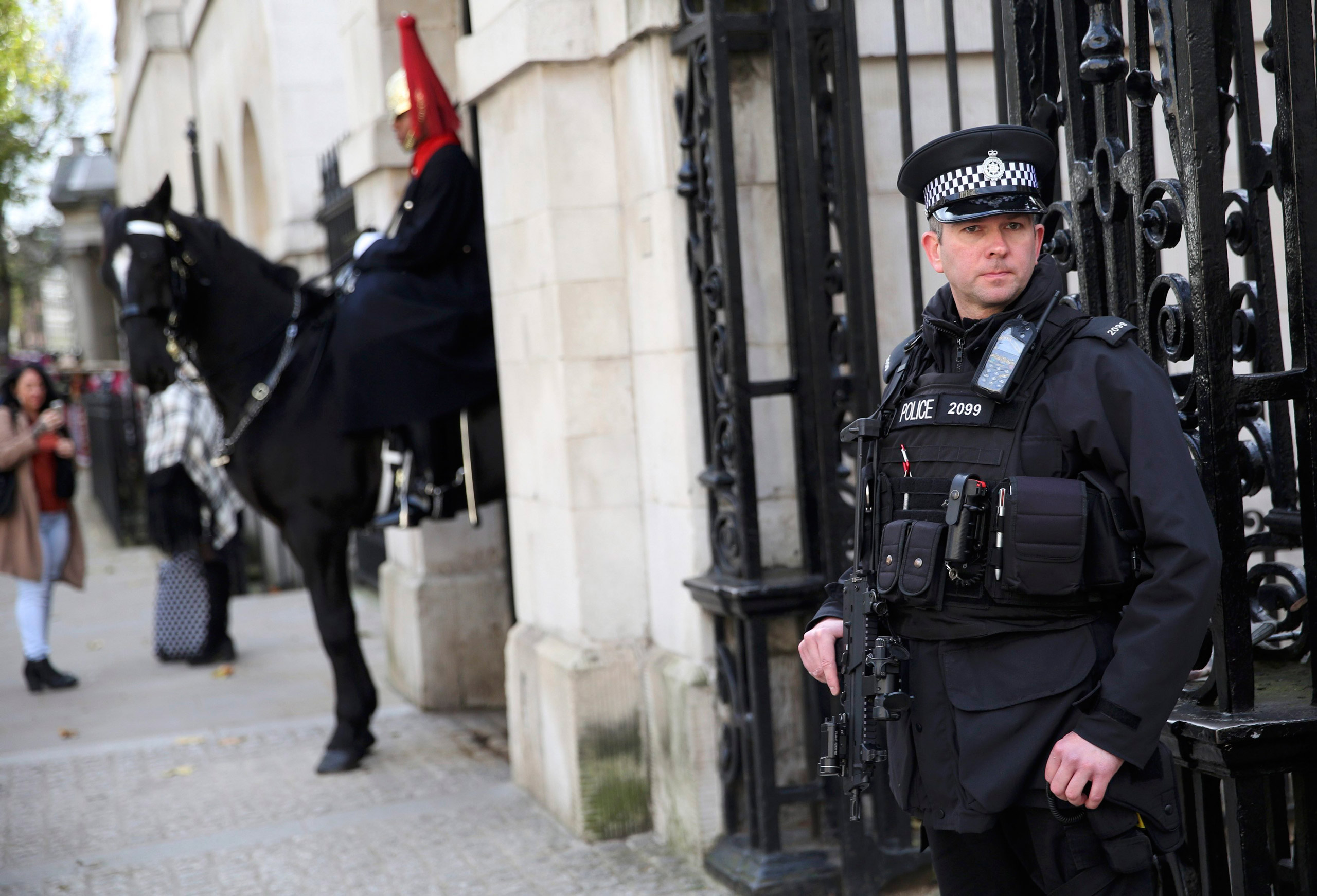 An armed police officer stands  outside Horseguards on Whitehall in London, Britain November 18, 2015. REUTERS/Neil Hall