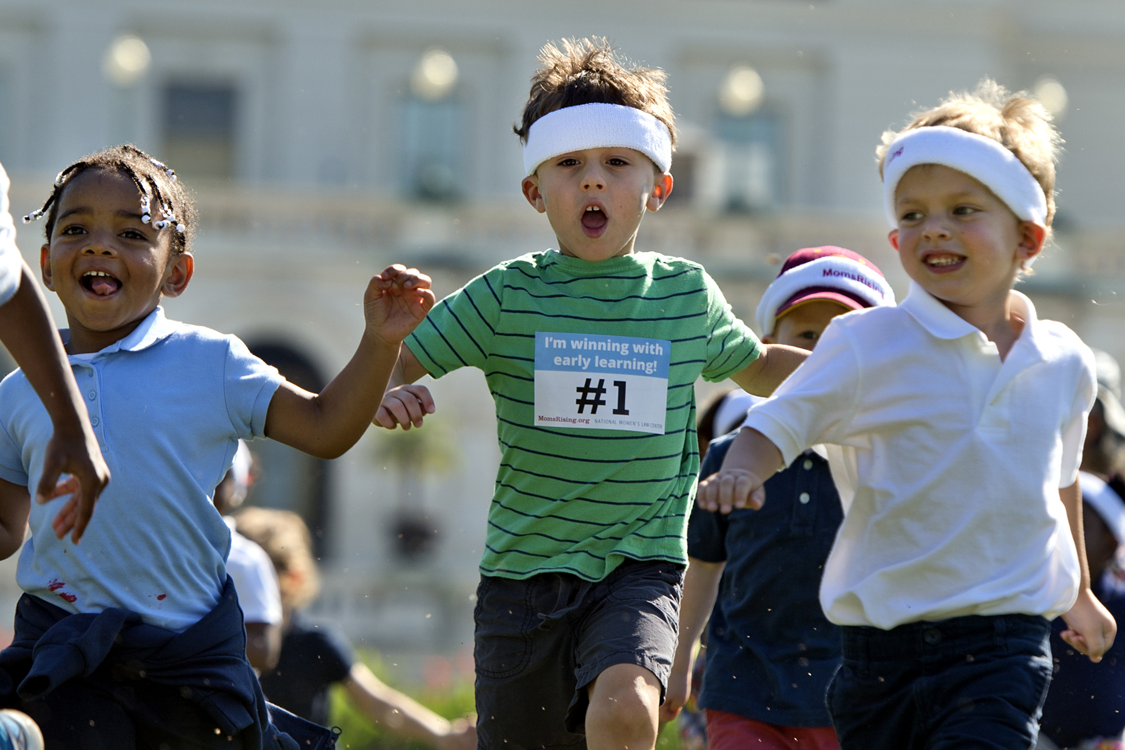 Children run a relay race during an event sponsored by co-hosted by MomsRising and the National Women’s Law Center to highlight the importance of affordable child care and early learning programs on Sept. 17, 2015. (Tom Williams—CQ-Roll Call/Getty Images)