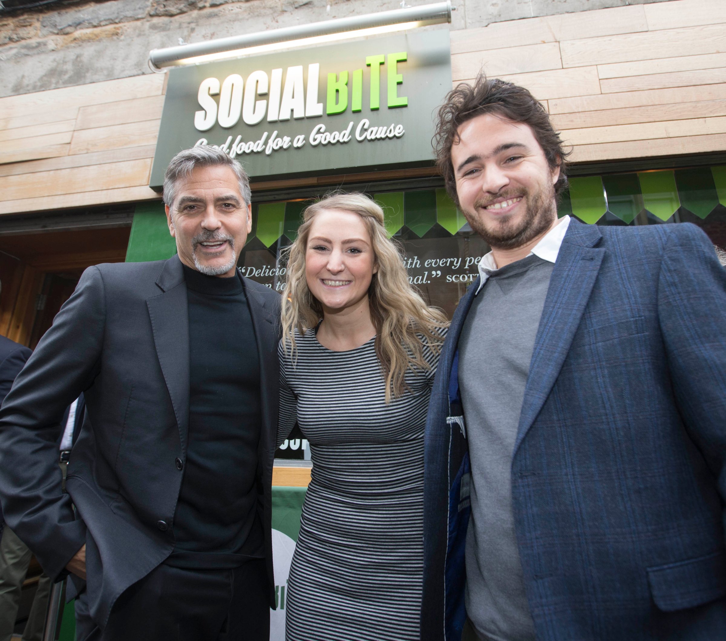 From left: George Clooney, and Social Bite co-founders Alice Thompson and Josh Littlejohn in Edinburgh, Scotland on Nov. 12, 2015.