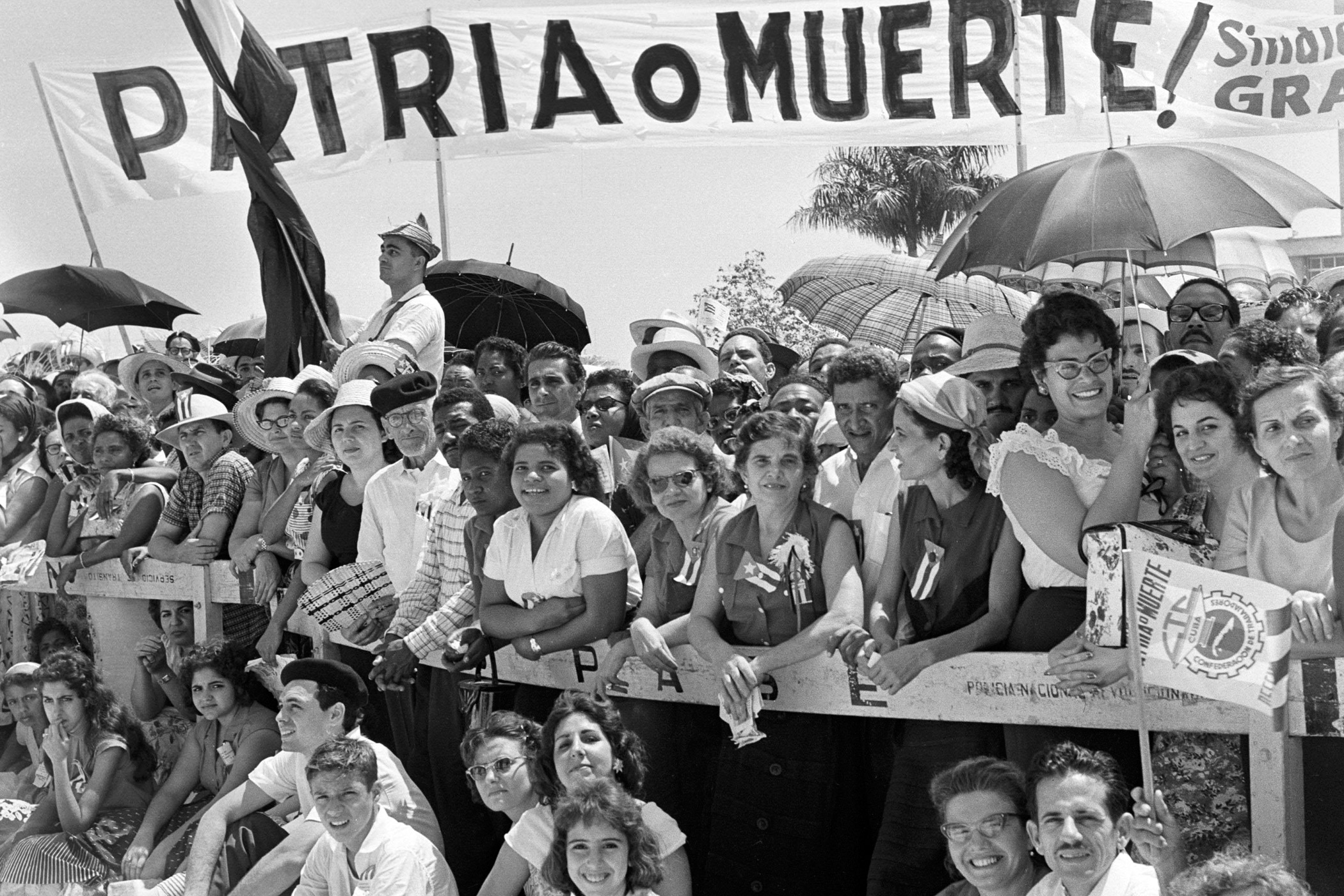 Cubans watch the May Day parade at the Plaza de la Revolucion in Havana on May 1, 1960.
