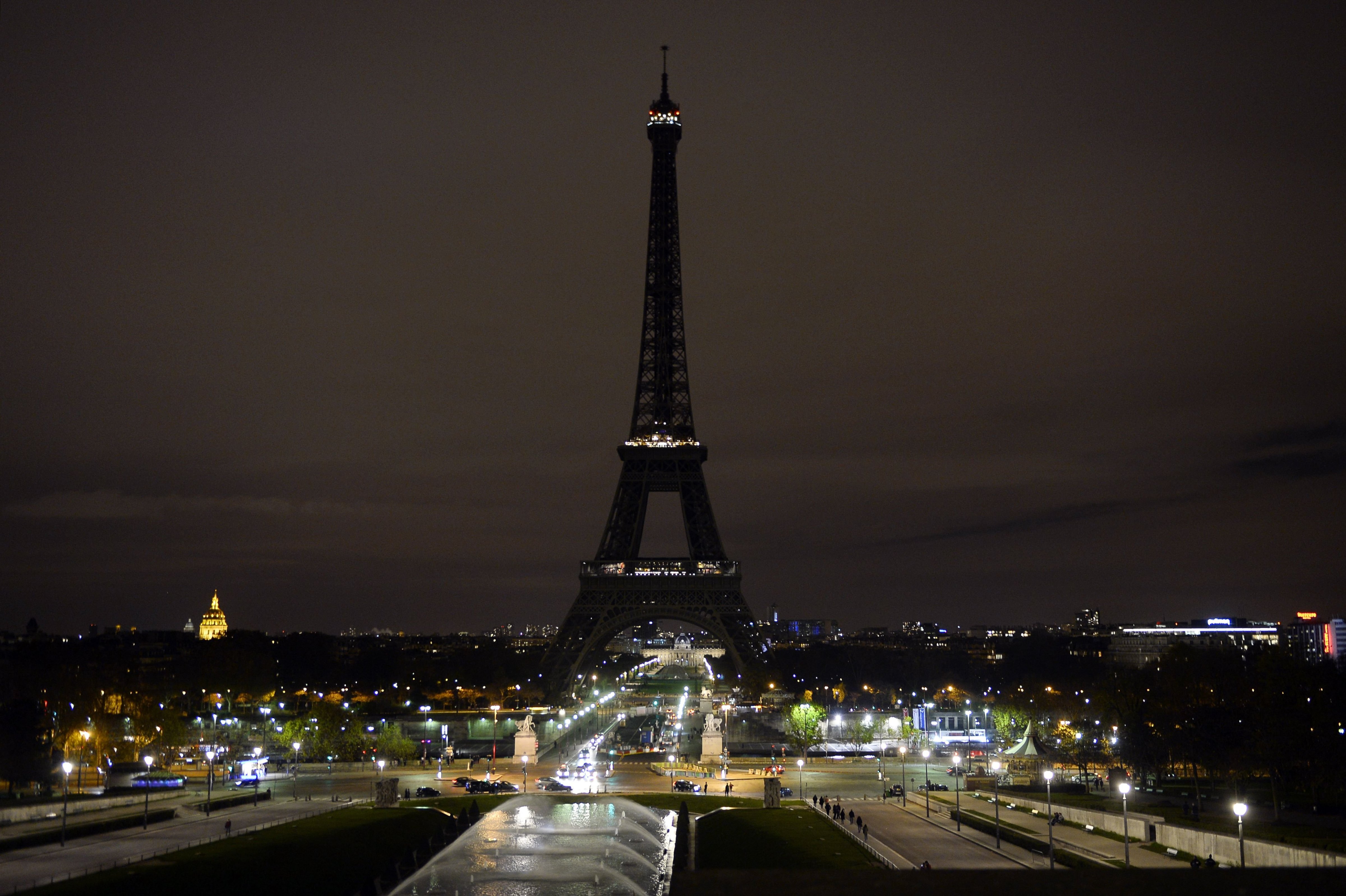 The Eiffel Tower with its lights turned off following the deadly attacks in Paris on Nov. 14, 2015. (Alain Jocard—AFP/Getty Images)