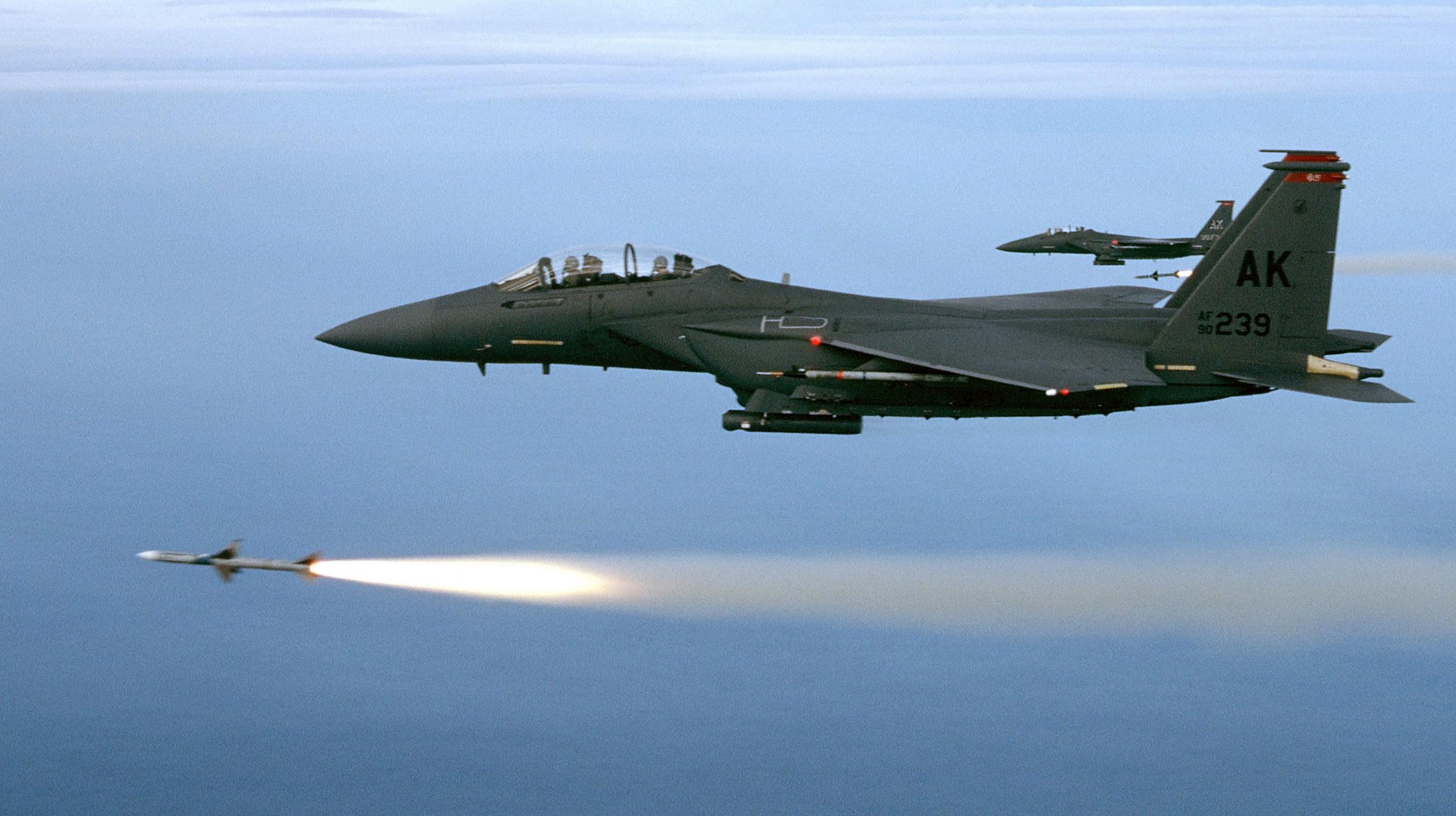 Two F-15E from the 90th Fighter Squadron, Elmedorf AFB, Alaska, fire a pair of AIM-7M's during a training mission. The mission took place over the Gulf of Mexico just off the coast of Florida. (U.S. Air Force Photo by Major Gary)