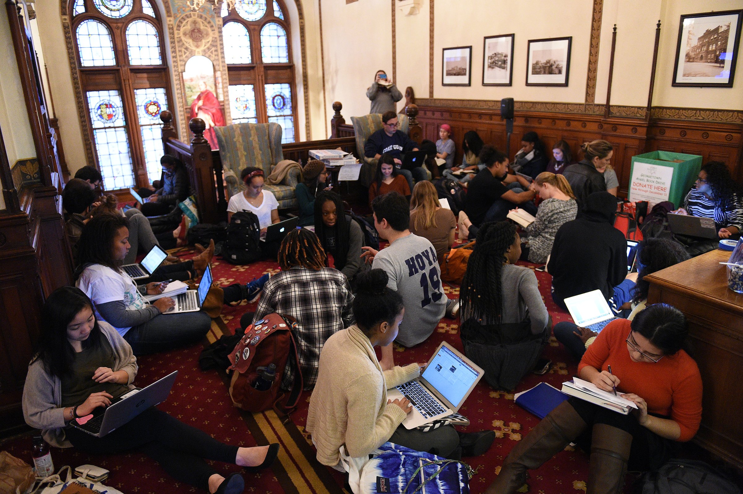 Around 30 students sit in in front of the office of John J. DeGioia, president of Georgetown University in Washington D.C. on Nov. 13, 2015. The sit in was in solidarity with other student protests throughout the country addressing racial discrimination on campus, including at University of Missouri and Yale University. The students also demanded the change of the name of Mulledy Hall on campus.