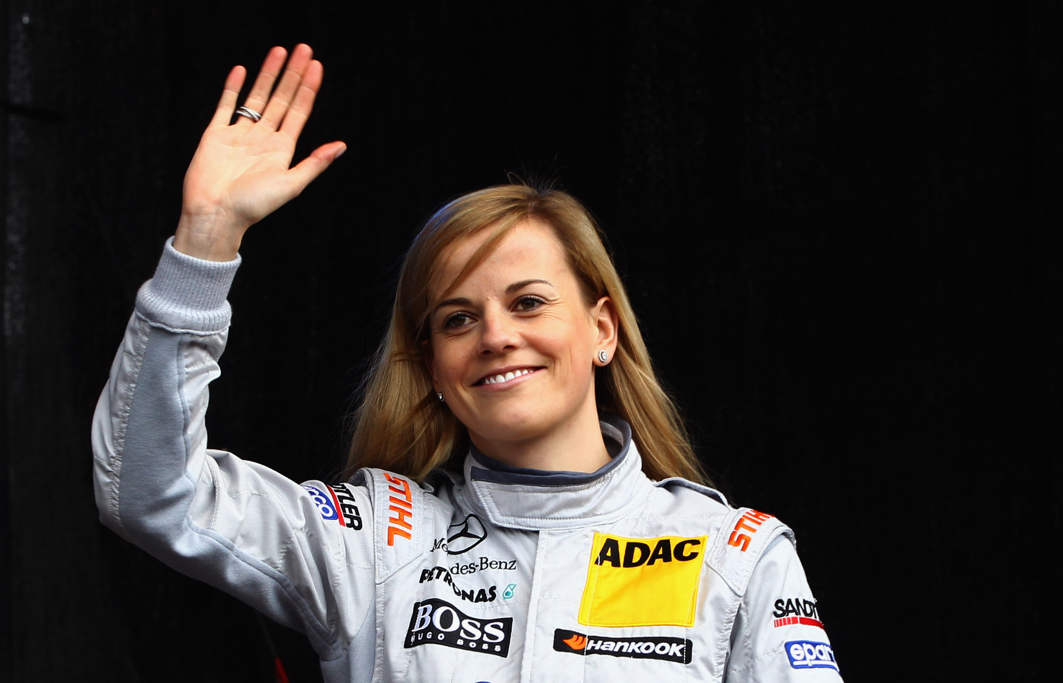 British Mercedes driver Susie Wolff waves during the DTM touring car presentation on April 22, 2012 in Wiesbaden, Germany. (Alex Grimm—Bongarts/Getty Images)