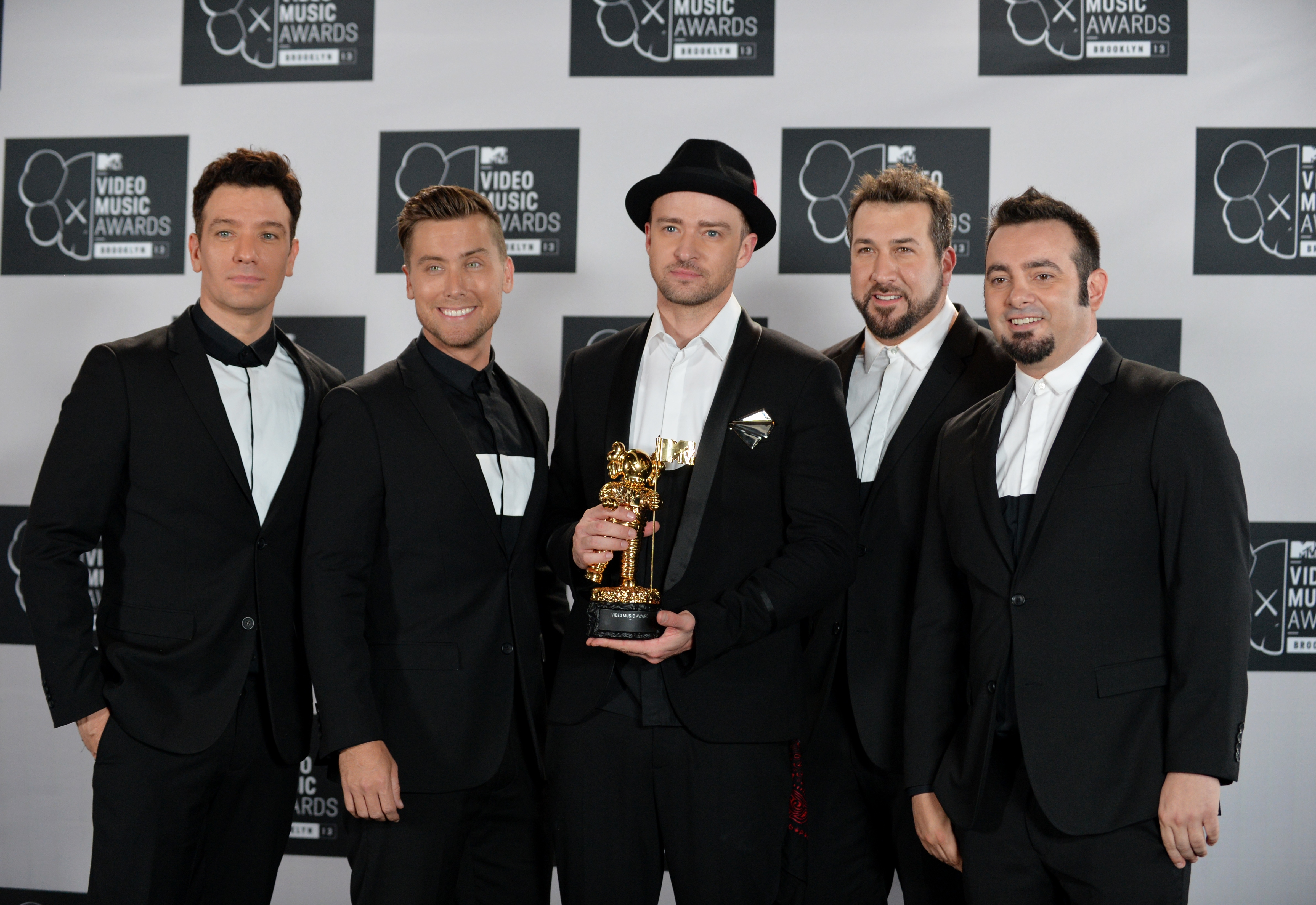 A reunited 'N Sync including Justin Timberlake (C), JC Chasez (L), Lance Bass (2nd L), Joey Fatone (2nd R), and Chris Kirkpatrick (R) at the MTV Video Music Awards August 25, 2013 at the Barclays Center in New York. (Stan Honda&mdash;AFP/Getty Images)