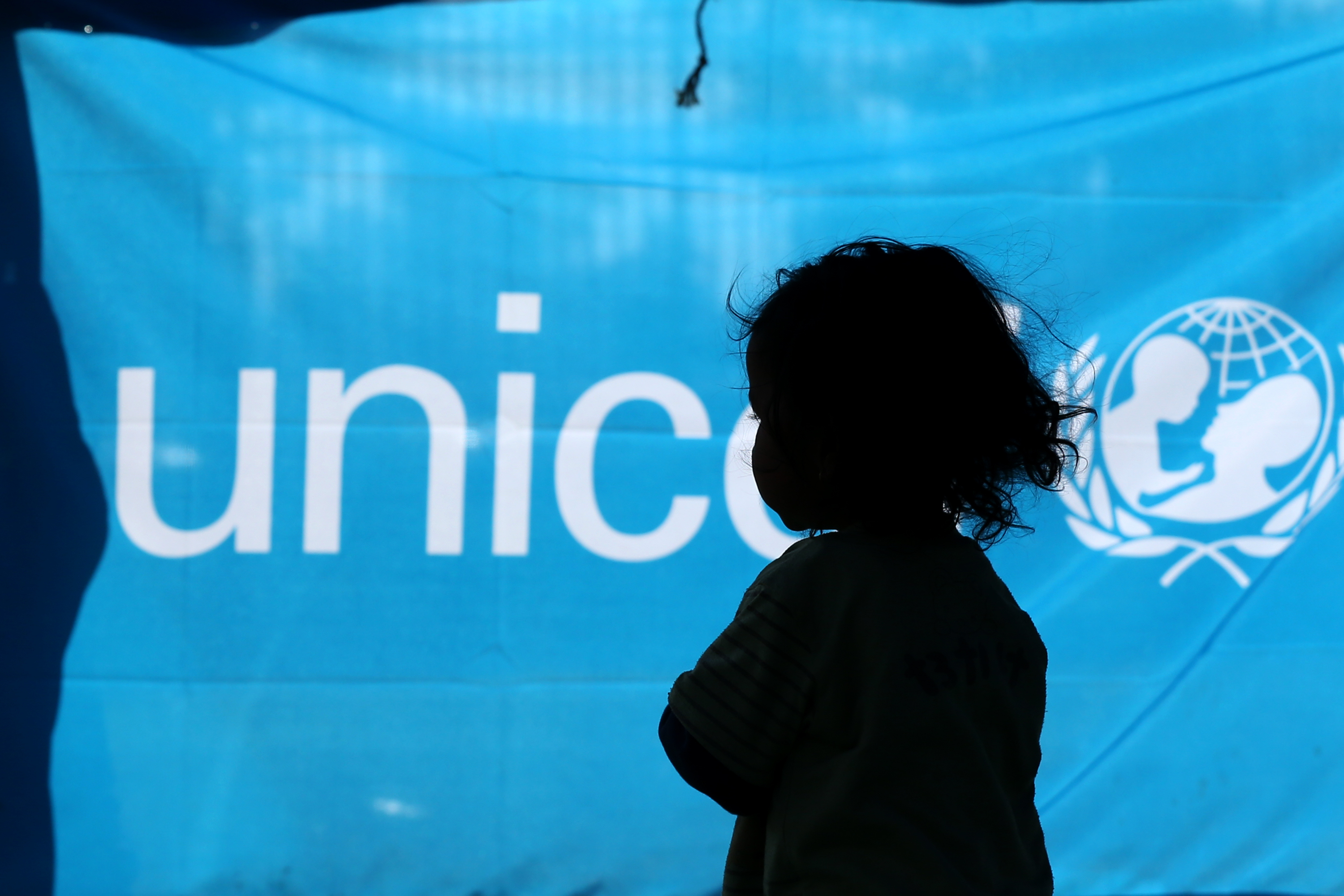 A young girl who was displaced by the earthquake walks inside a UNICEF tent at Tudhikhel makeshift camp in Kathmandu, Nepal on May 4, 2015. (Buddhika Weerasinghe—Getty Images)