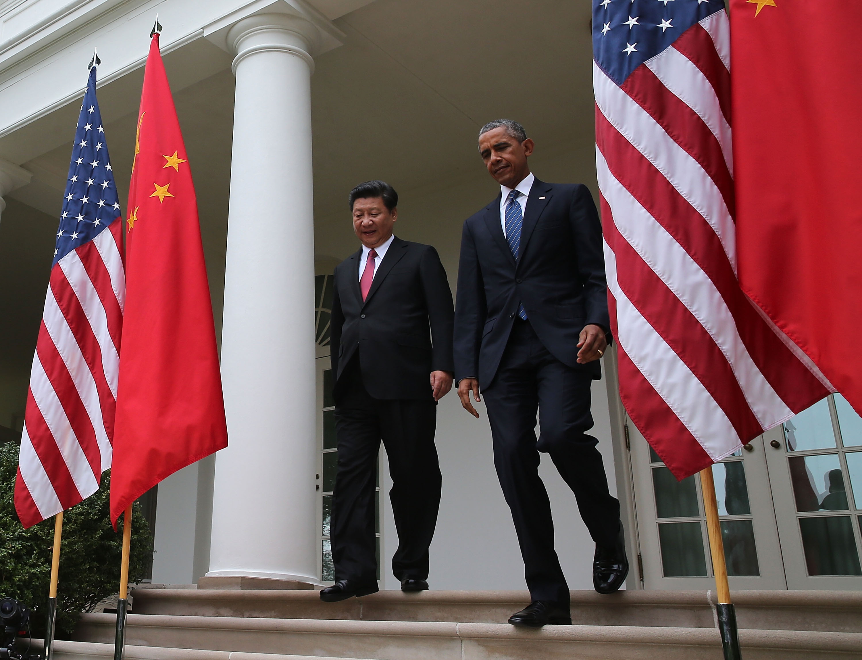 U.S. President Barack Obama (R) and Chinese President Xi Jinping walk arrive to a joint news conference at The White House on Sept. 25, 2015 in Washington, DC (Mark Wilson—Getty Images)