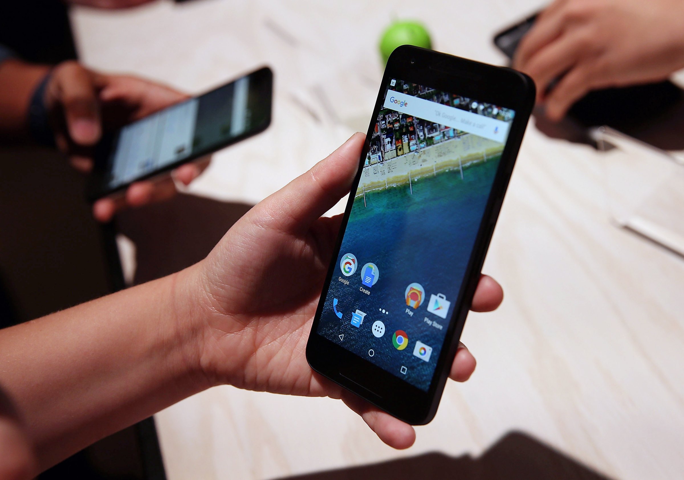SAN FRANCISCO, CA - SEPTEMBER 29:  An attendee inspects the new Nexus 5X phone during a Google media event on September 29, 2015 in San Francisco, California. Google unveiled its 2015 smartphone lineup, the Nexus 5x and Nexus 6P, the new Chromecast and new Android 6.0 Marshmallow software features.  (Photo by Justin Sullivan/Getty Images)