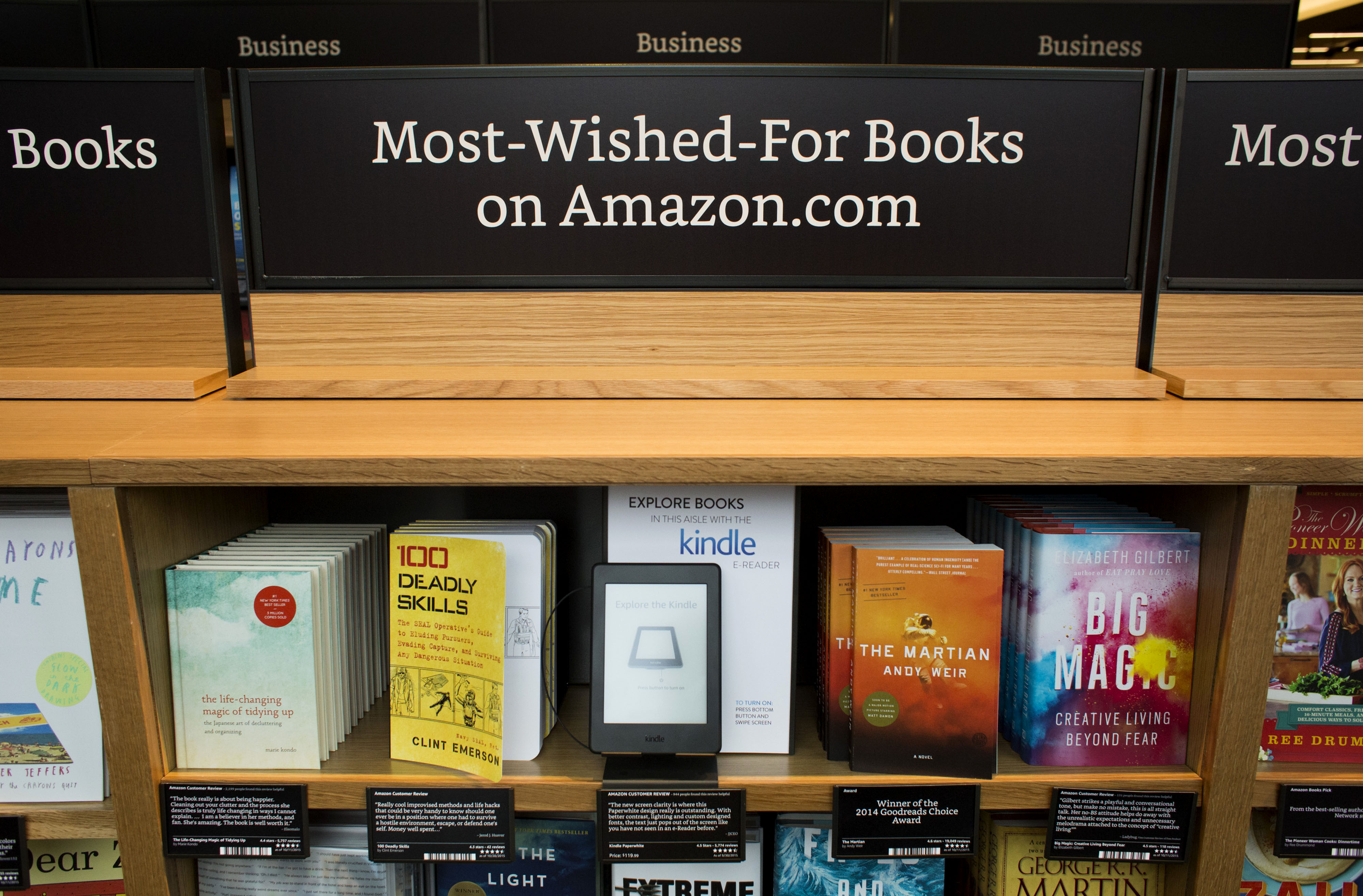 Books are display for sale at the Amazon Books store in Seattle, Washington, U.S., on Tuesday, Nov. 3, 2015. Amazon.com Inc.'s store lets shoppers pick up books and try the online retailer's gadgets, including the Fire TV streaming device, Fire tablet and Kindle electronic reader. Photographer: David Ryder/Bloomberg via Getty Images (Bloomberg—Bloomberg via Getty Images)