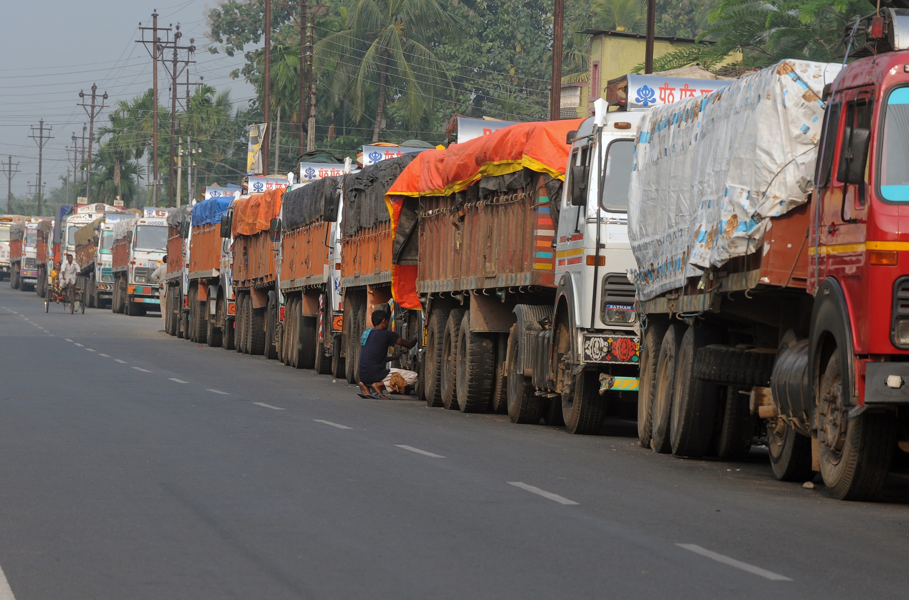 Indian trucks loaded with goods are seen parked near the India-Nepal border at Panitanki on Nov. 5, 2015 (Diptendu Dutta—AFP/Getty Images)