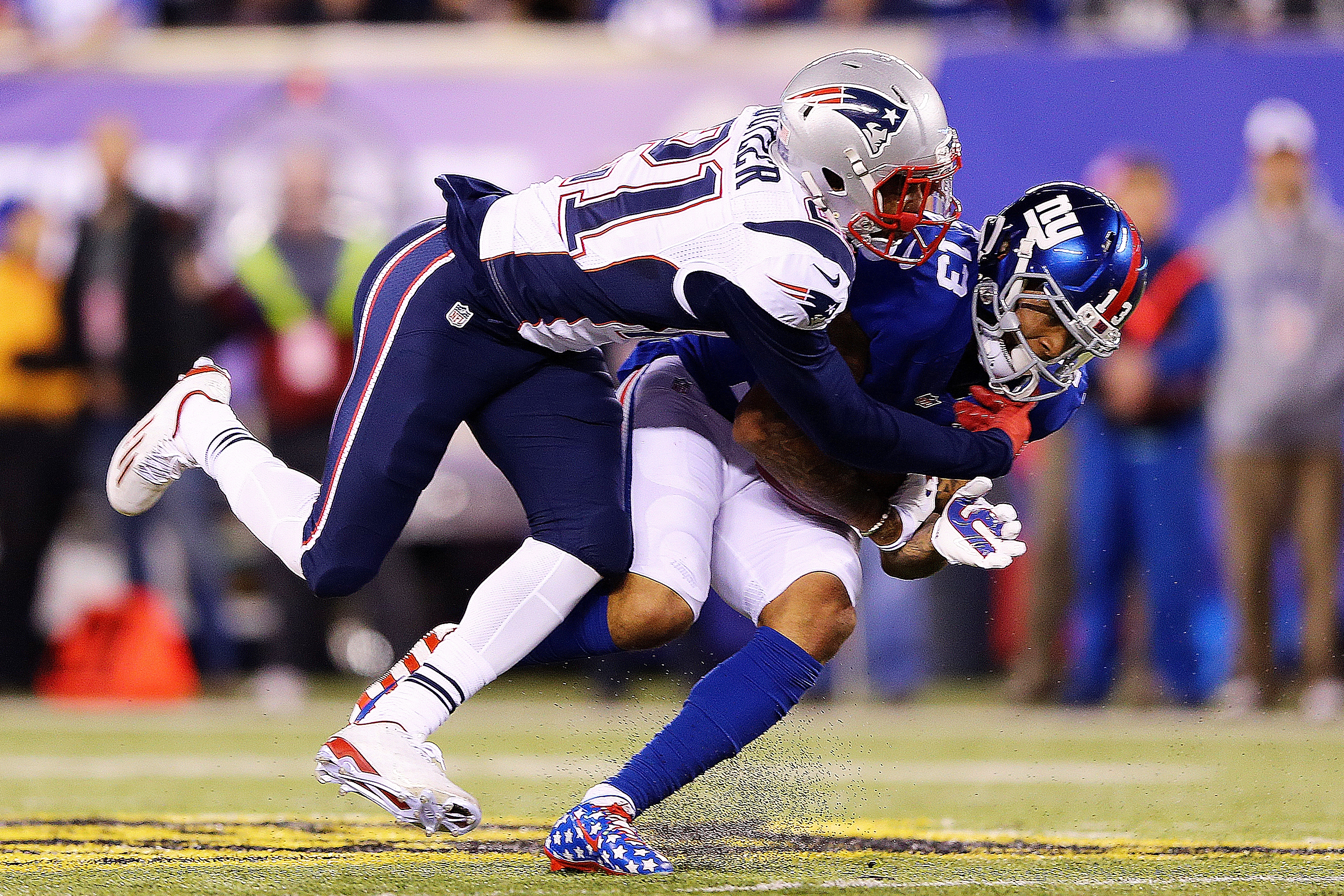 Odell Beckham #13 of the New York Giants is tackled by Malcolm Butler #21 of the New England Patriots during the third quarter at MetLife Stadium on November 15, 2015 in East Rutherford, New Jersey. (Elsa&mdash;Getty Images)