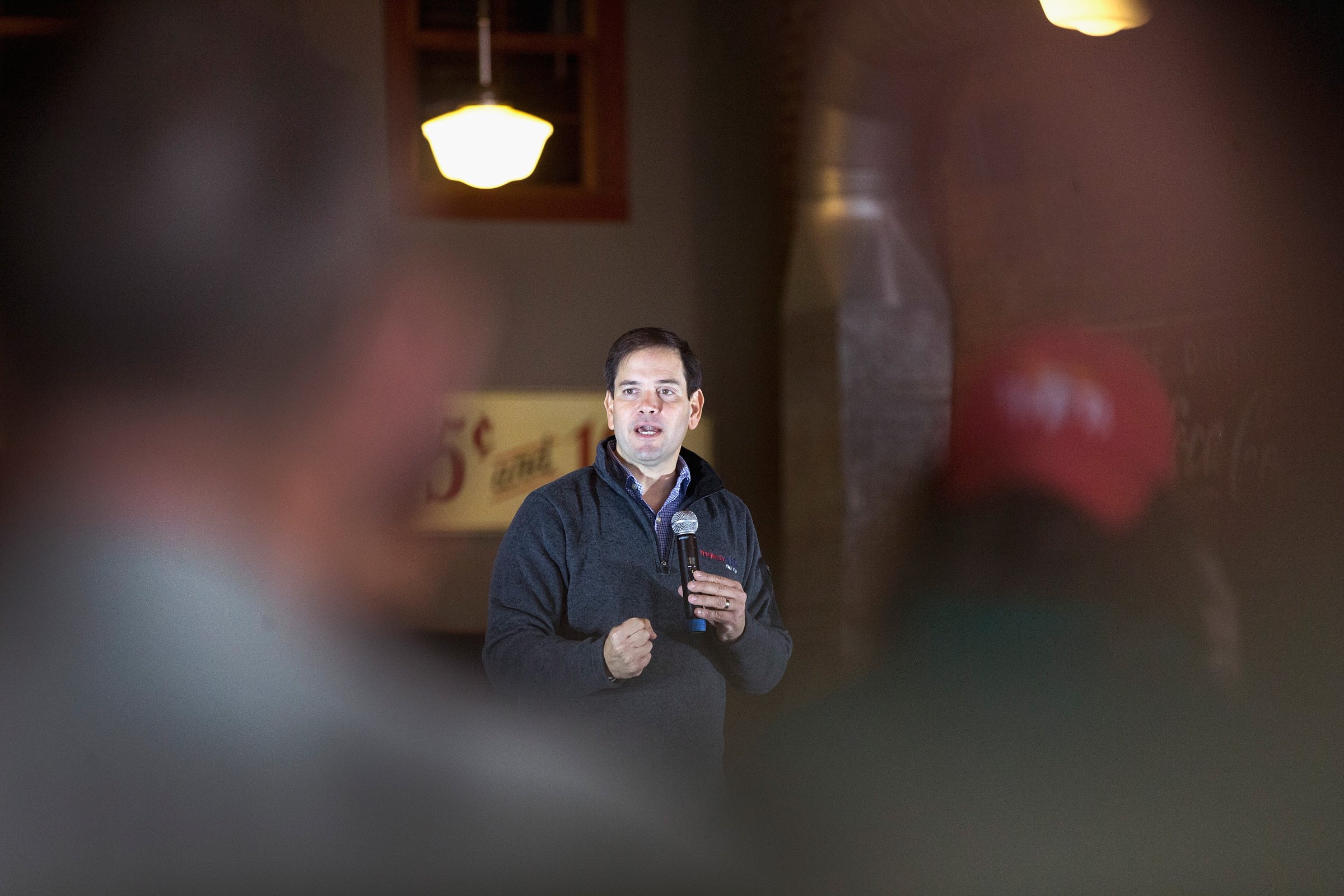 Republican presidential candidate Sen. Marco Rubio speaks to guests during a campaign stop at Smokey Row Coffee House in Oskaloosa, Iowa on Nov. 21, 2015.