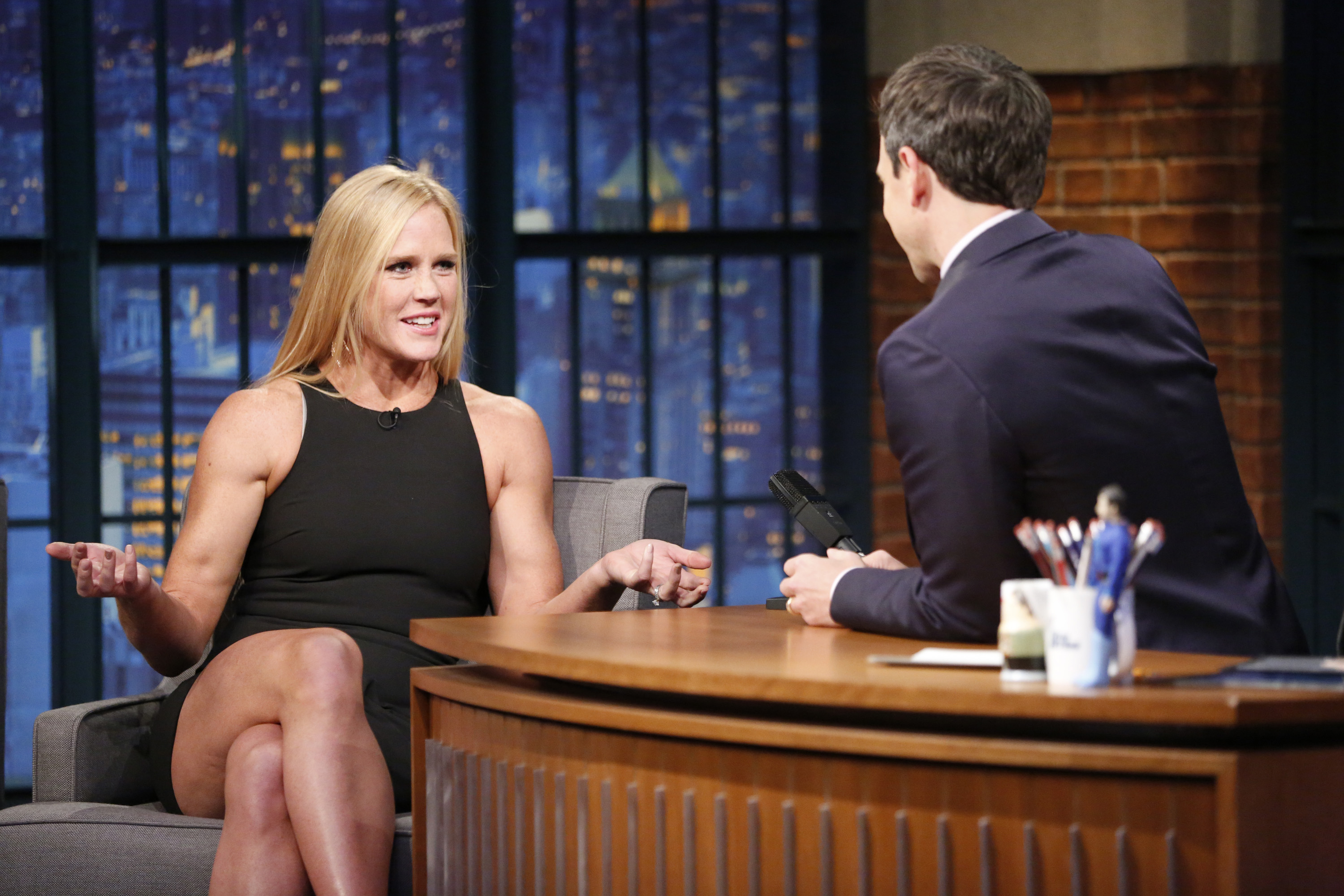Pictured: (l-r) Holly Holm, UFC Women's Bantamweight Champion, during an interview with host Seth Meyers on November 18, 2015. (NBC—NBCU Photo Bank via Getty Images)