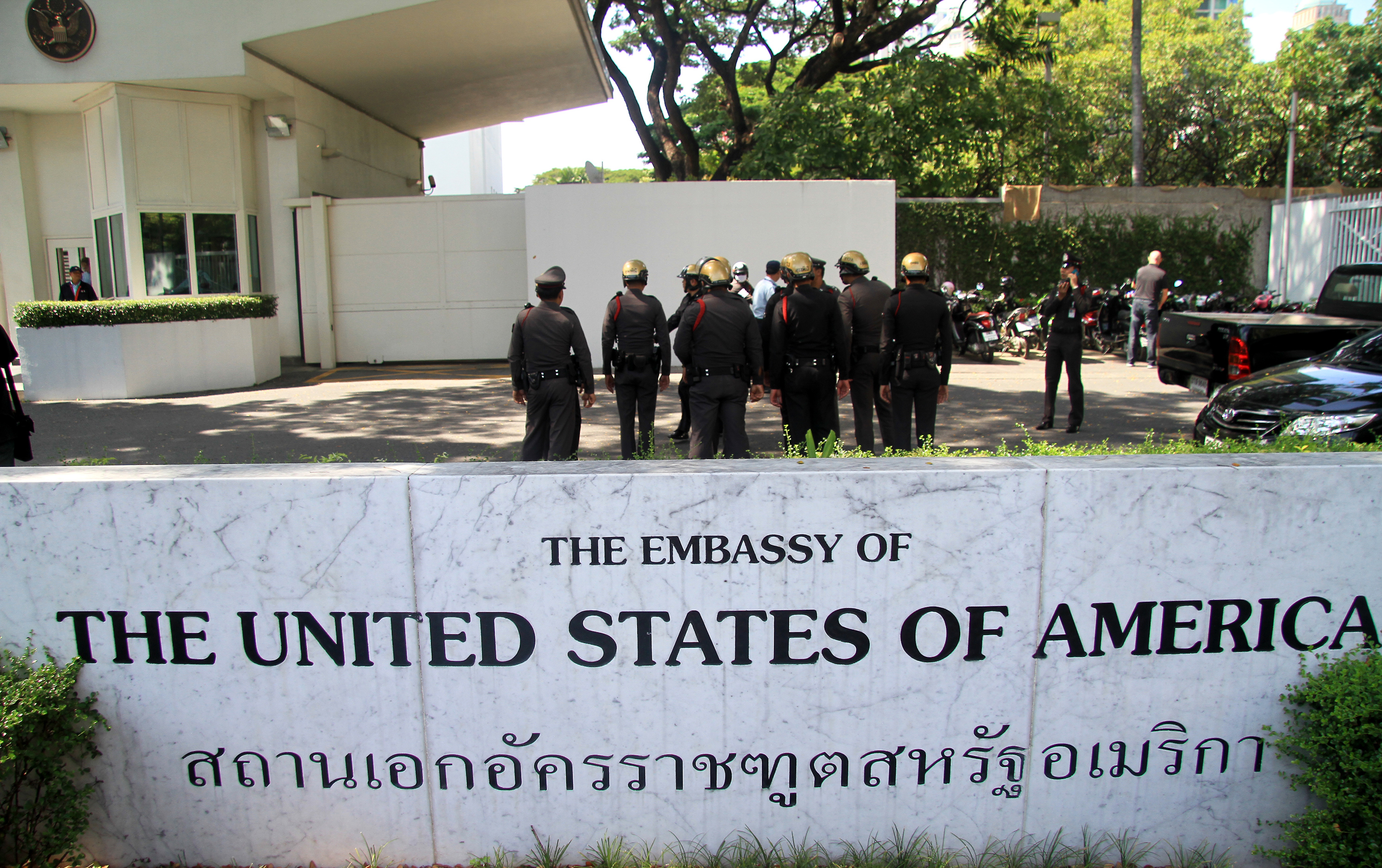 Policemen huddled up in the US Embassy. Buddha Isara