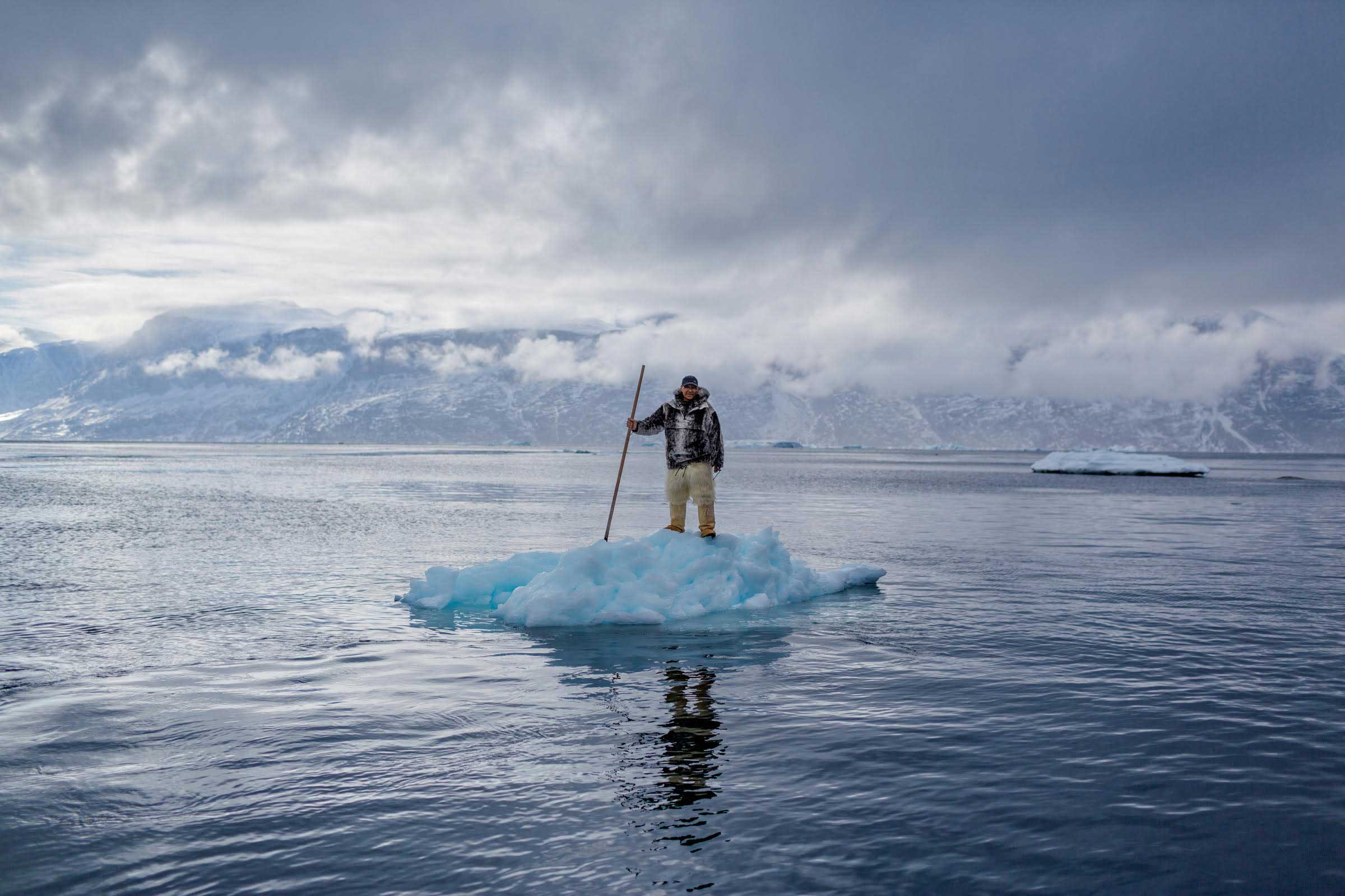 From the November issue of National Geographic magazine: How Melting Ice Changes One Country’s Way of Life Albert Lukassen’s world is melting around him. When the 64-year-old Inuit man was young, he could hunt by dogsled on the frozen Uummannaq Fjord, on Greenland’s west coast, until June. This photo shows him there in April.
