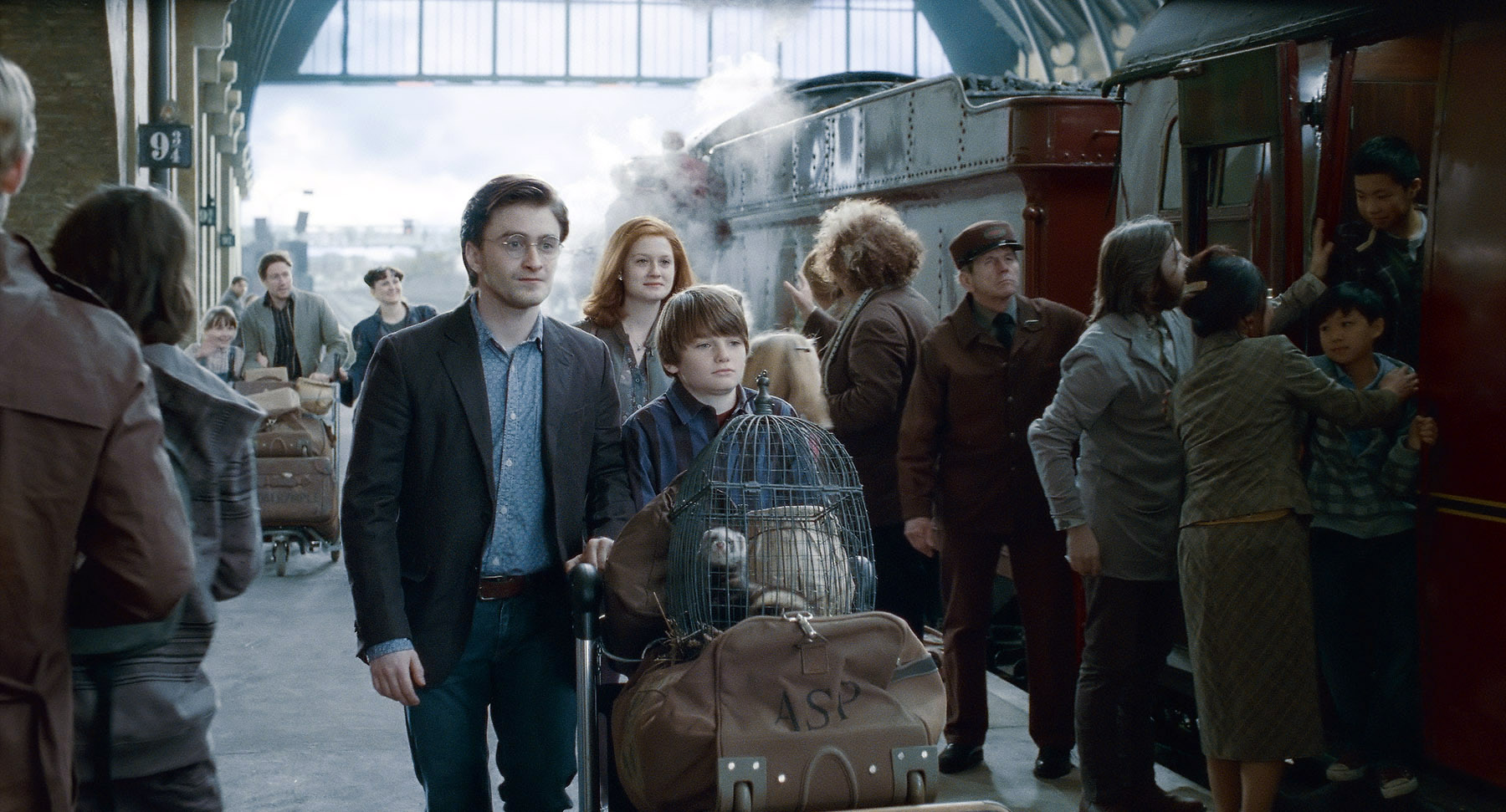 Daniel Radcliffe as Harry Potter and Arthur Bowen as Albus Severus Potter in <em>Harry Potter and the Deathly Hallows - Part 2</em> (Warner Bros.)