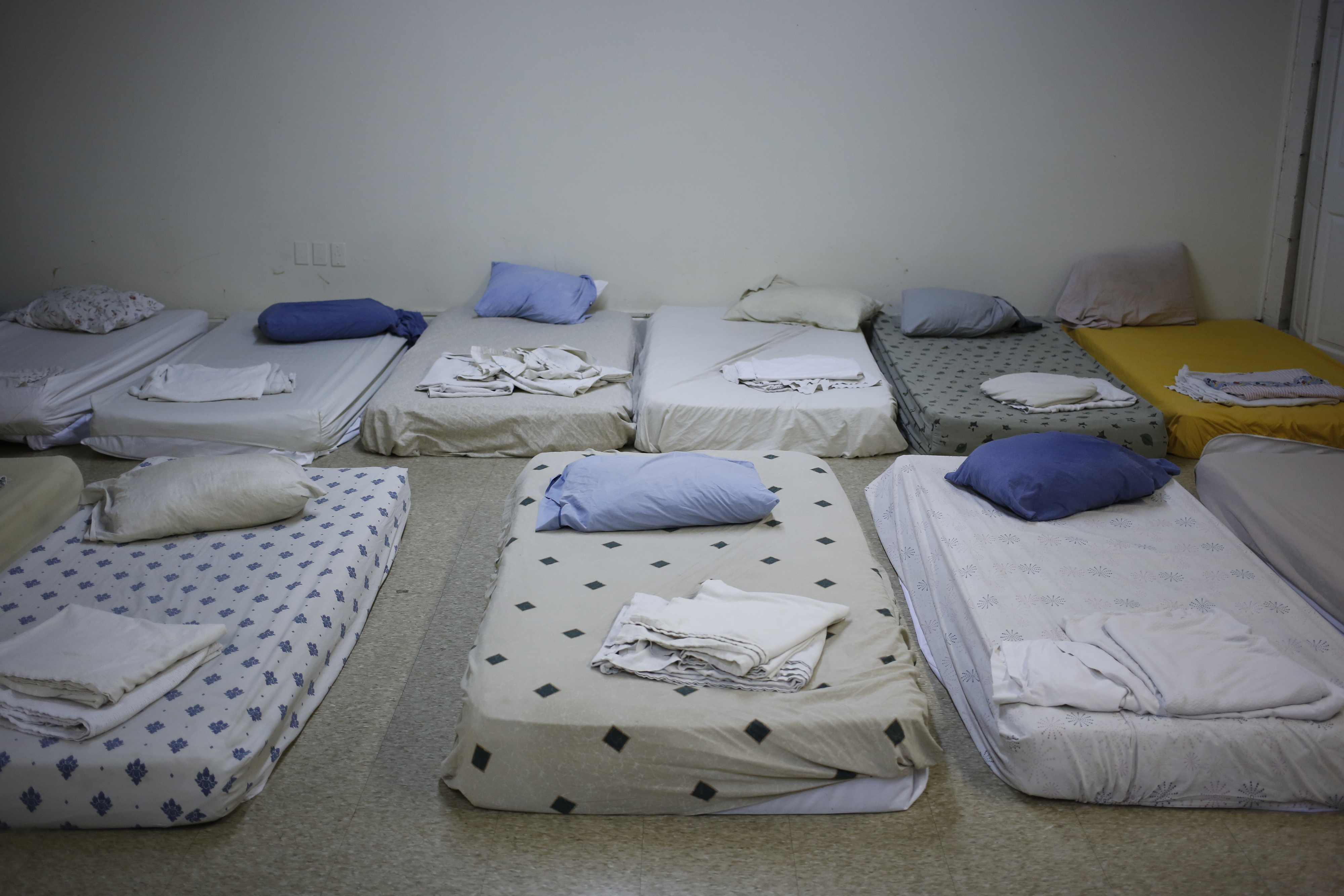 Beds for the homeless are prepared inside the Community Inn homeless shelter in Lexington, KY on Nov. 19, 2013. (Bloomberg/Getty Images)