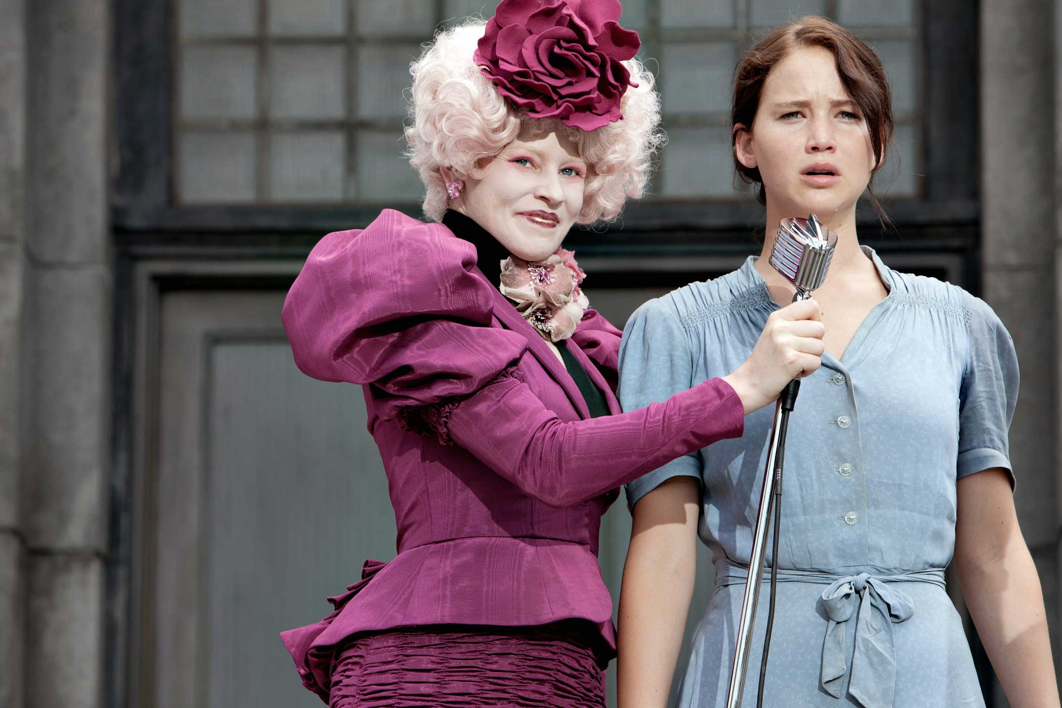 Elizabeth Banks as Effie Trinket and Jennifer Lawrence as Katniss Everdeen in The Hunger Games, 2012.